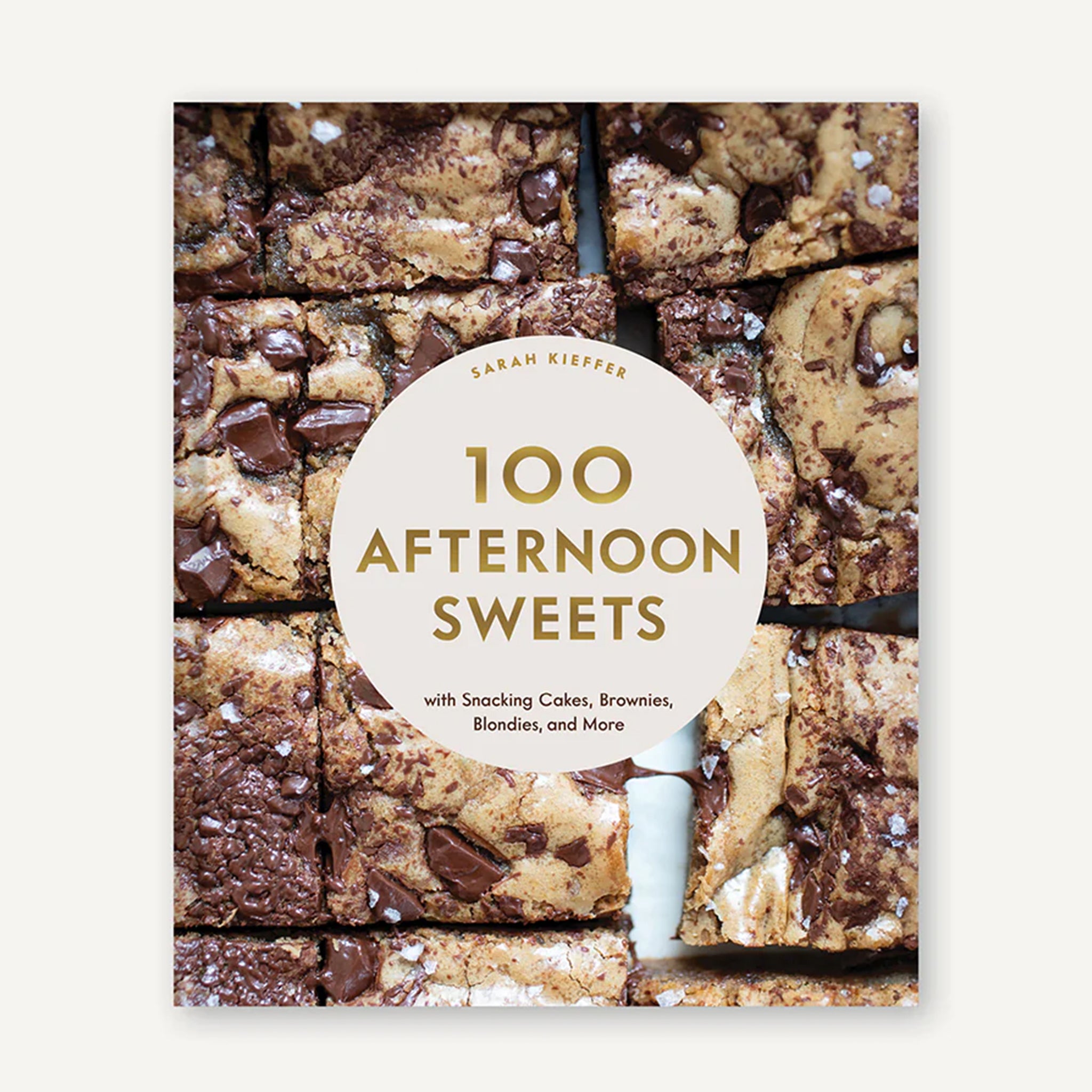 A book cover with chocolate chip bars and gold foiled text in the center that reads, &#39;100 Afternoon Sweets&#39;. 