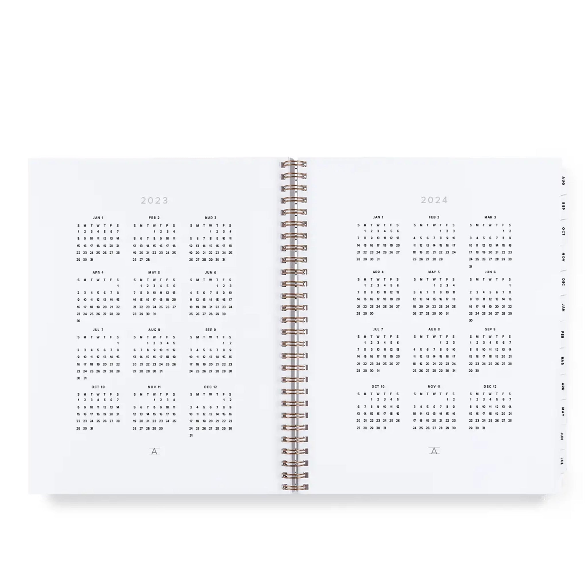 On a white background is a tan spiral bound yearly planner with small gold text at the top that reads, &quot;23-24 Year Task Planner&quot;.