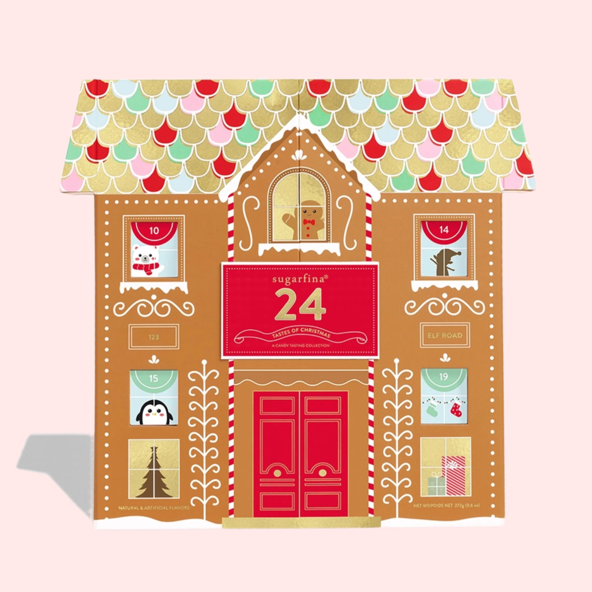 A candy advent calendar with multi colored roof and red door. 