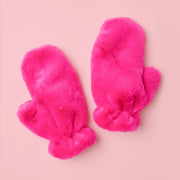 Hot pink fur mittens shown against a baby pink background.