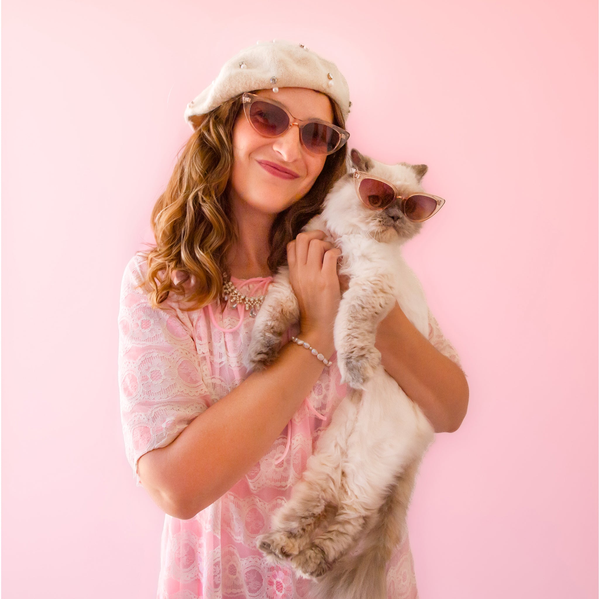 A translucent tan pair of cat-eye shaped sunglasses.