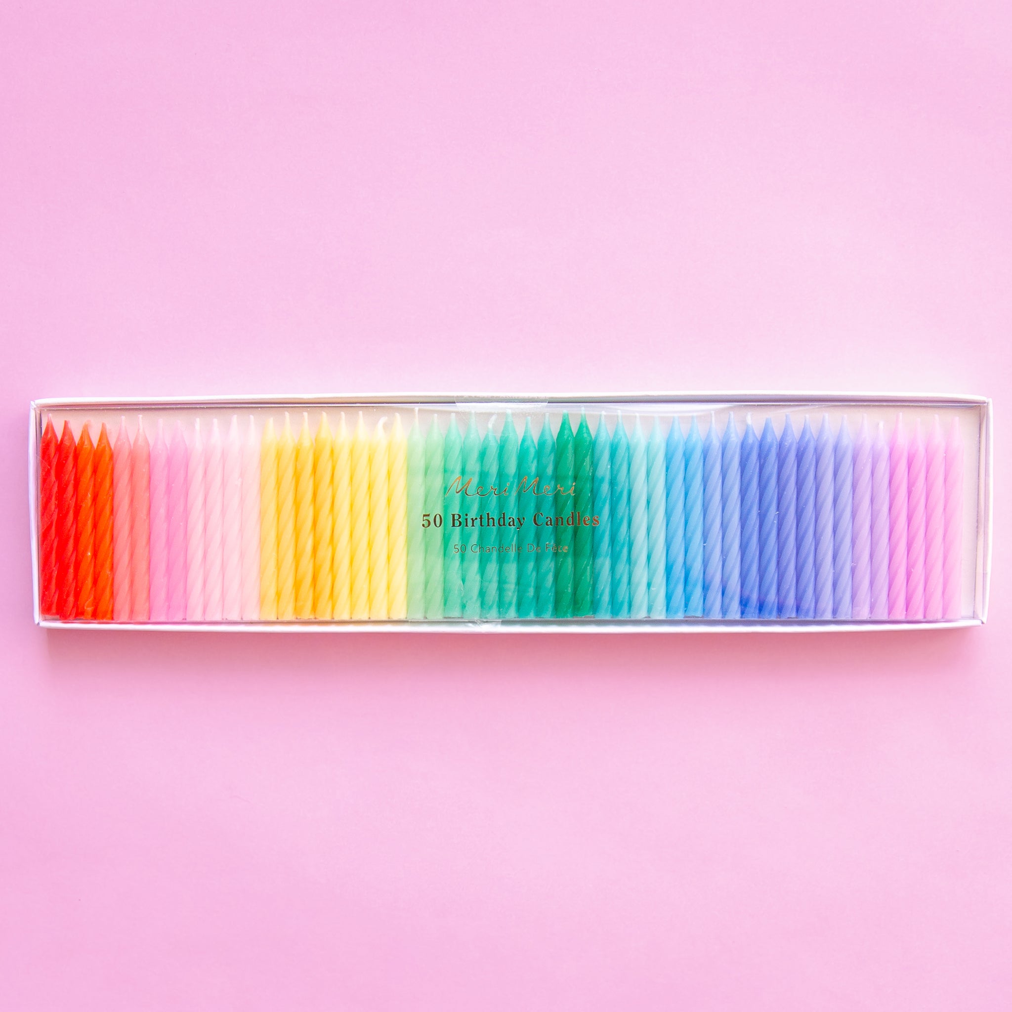 A pack of 50 twisted candles in all the colors of the rainbow