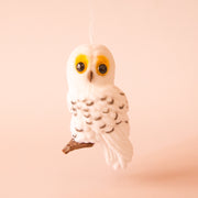 A white owl shaped ornament. 