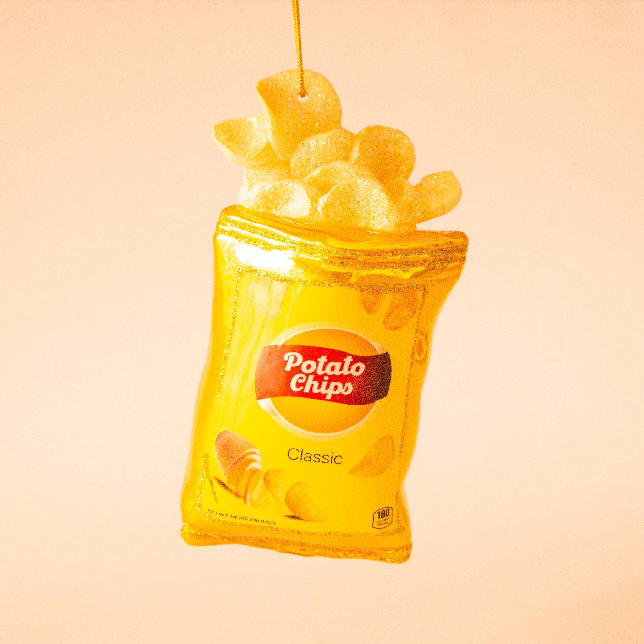 A yellow and gold potato chips bag shaped ornament. 