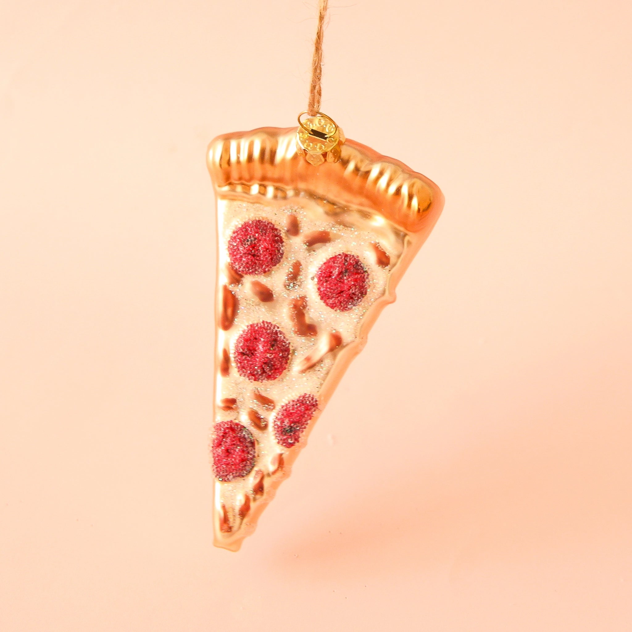 A slice of pepperoni pizza ornament with glittery cheese and golden crust. Metallic thread 3.5" loop for hanging.