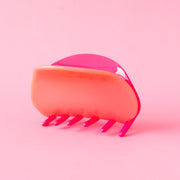A two-toned, pink and light pink claw clip with rounded edges.