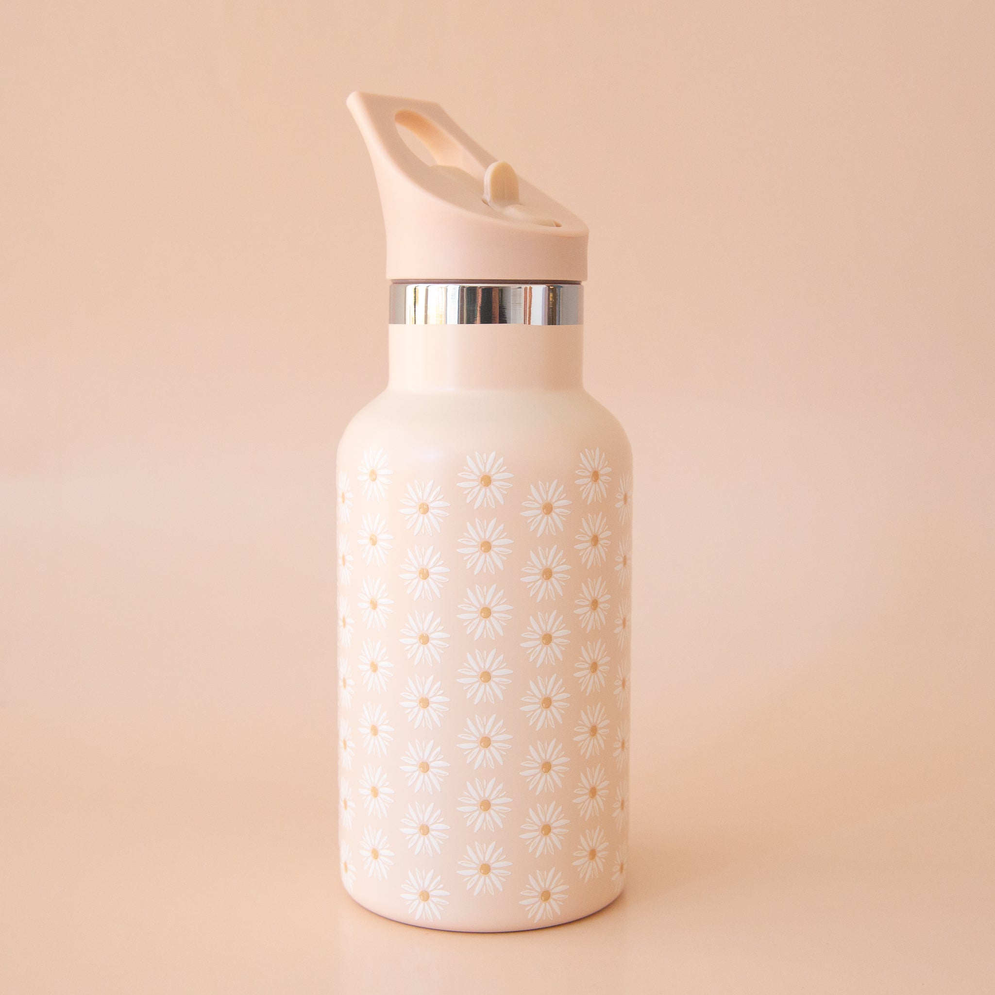 On a peachy background is a floral printed water bottle. 