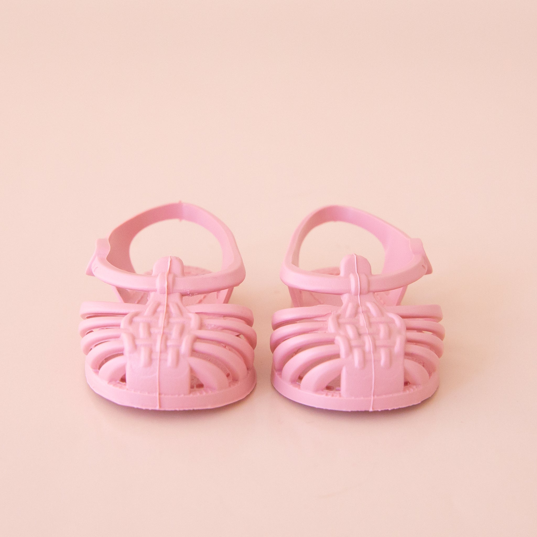 Pink plastic sandals for a Minikane doll.