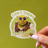 A sticker with Shrek on it wearing pink sunglasses and text above and below that reads, "Can't Today I'm Swamped".