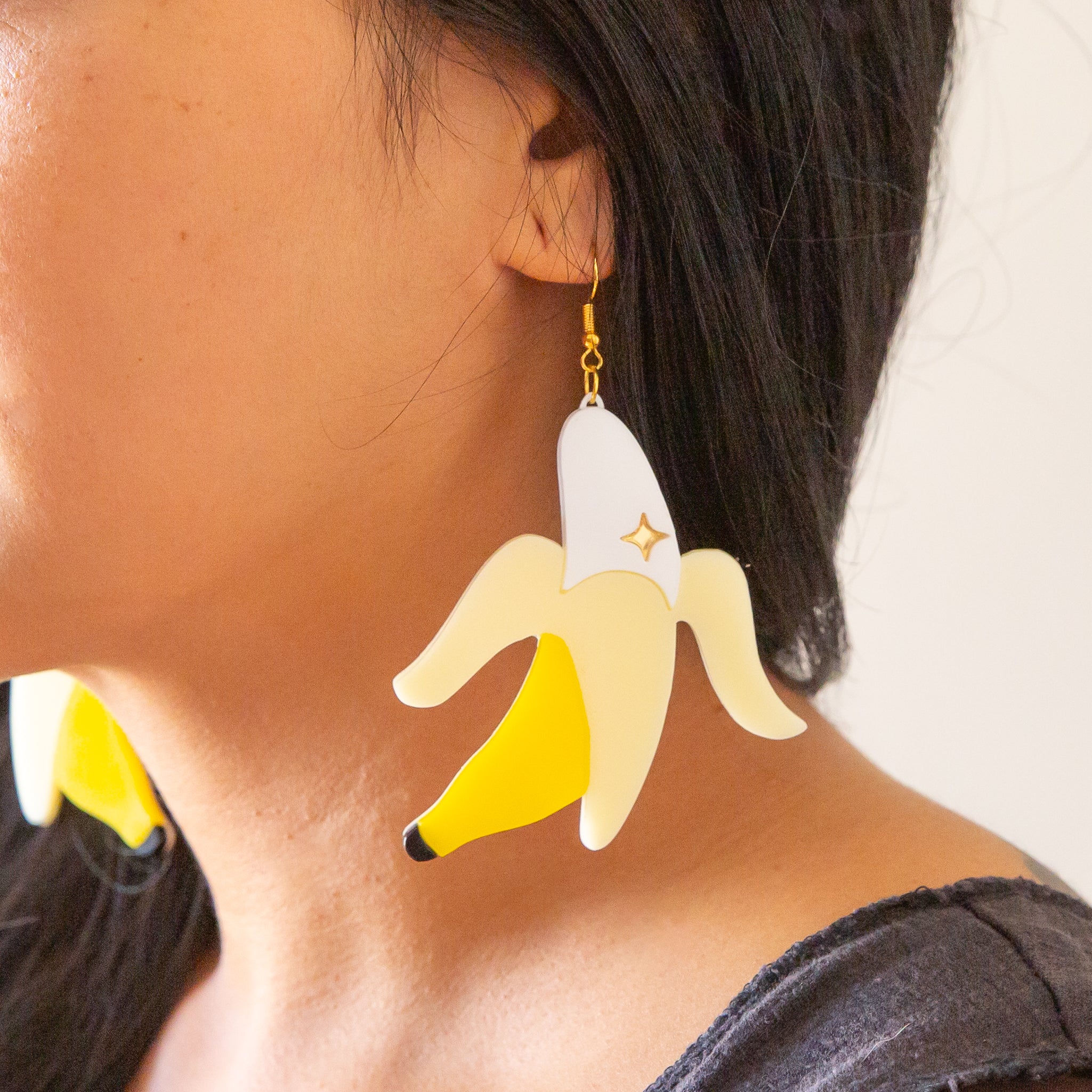 Banana shaped earrings with a gold plated hook.