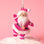 A hot pink suited Santa shape holiday ornament. 