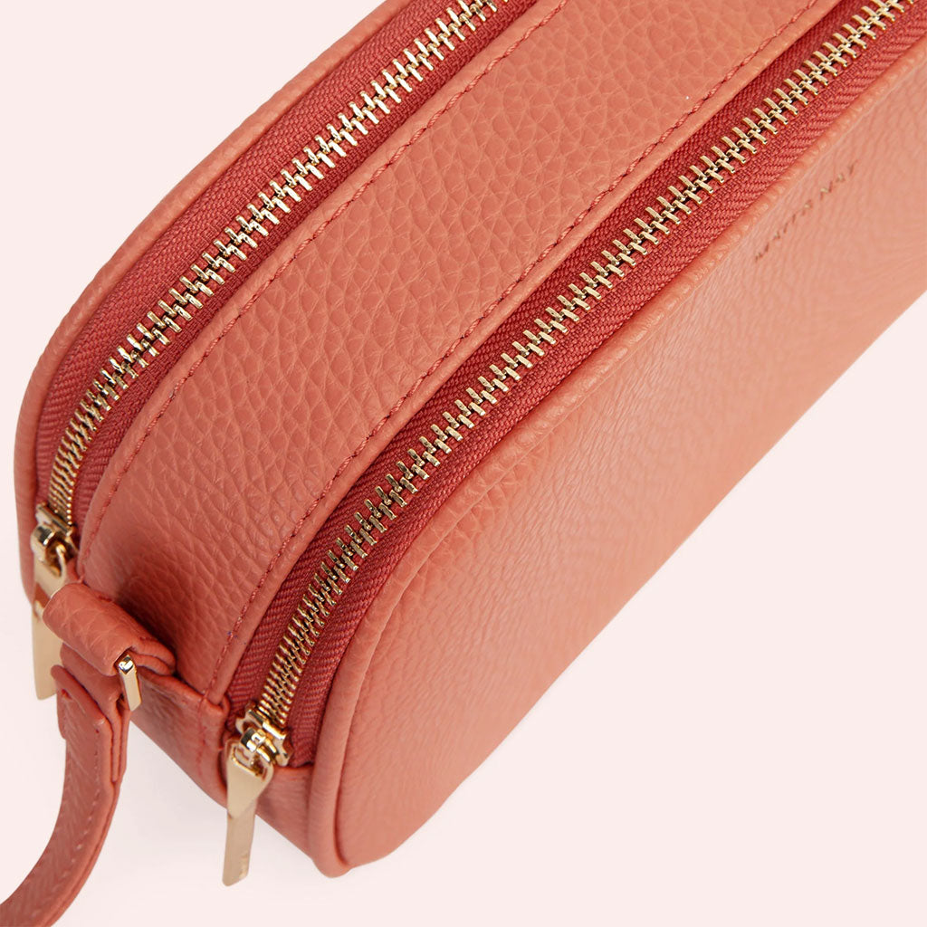 coral colored crossbody bag