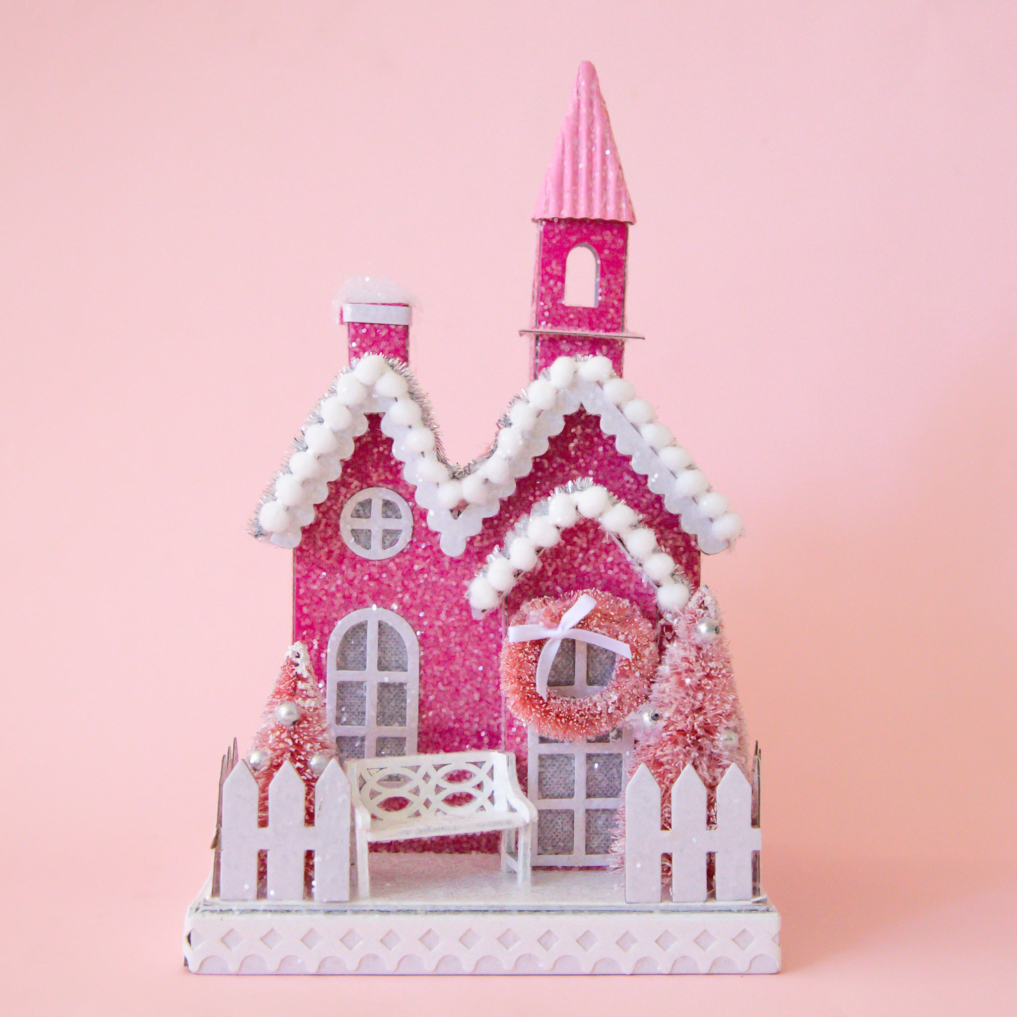 A pink church shaped holiday display.