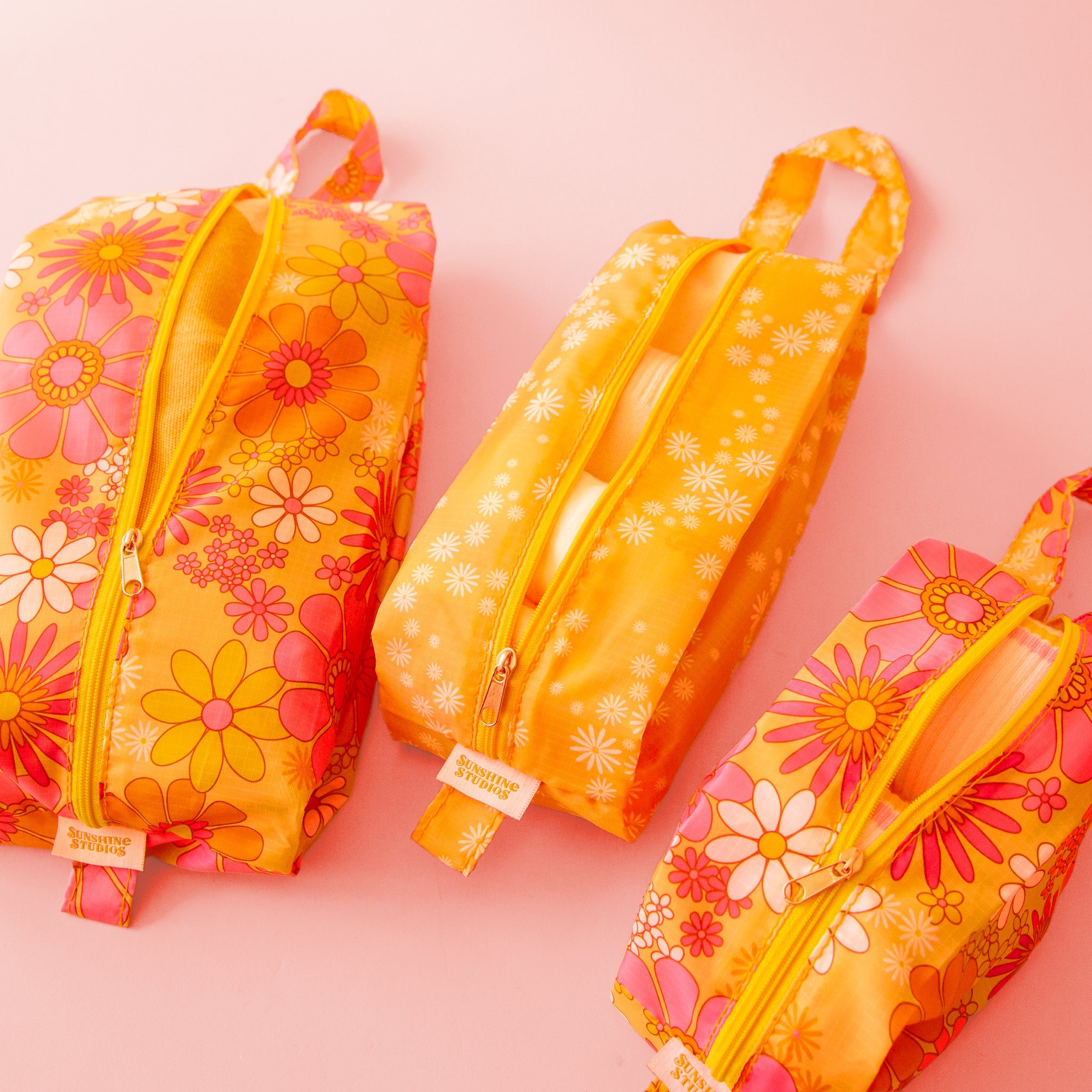 orange packing pouches with pink and ivory 70&#39;s floral design