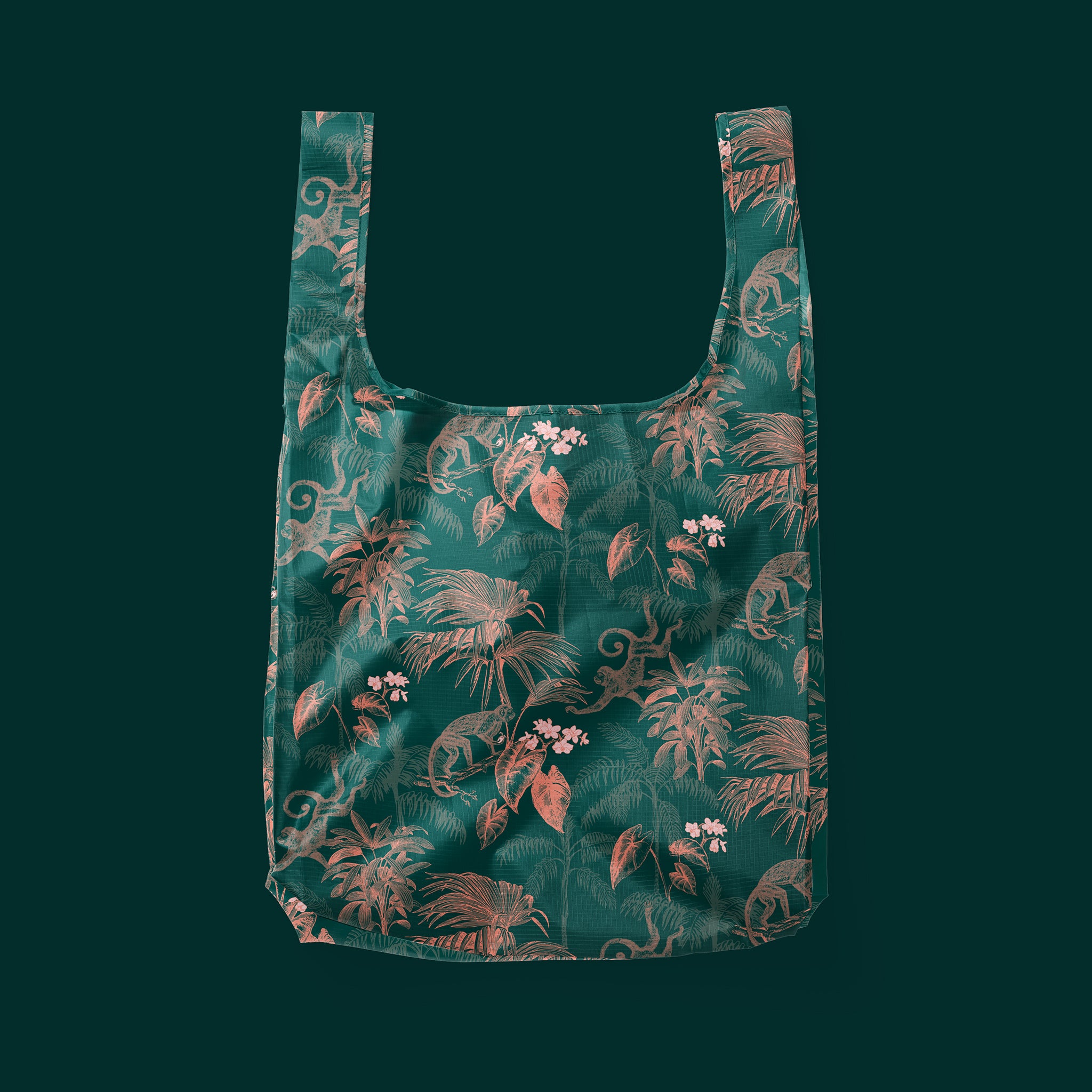 A green and apricot jungle print nylon tote bag.