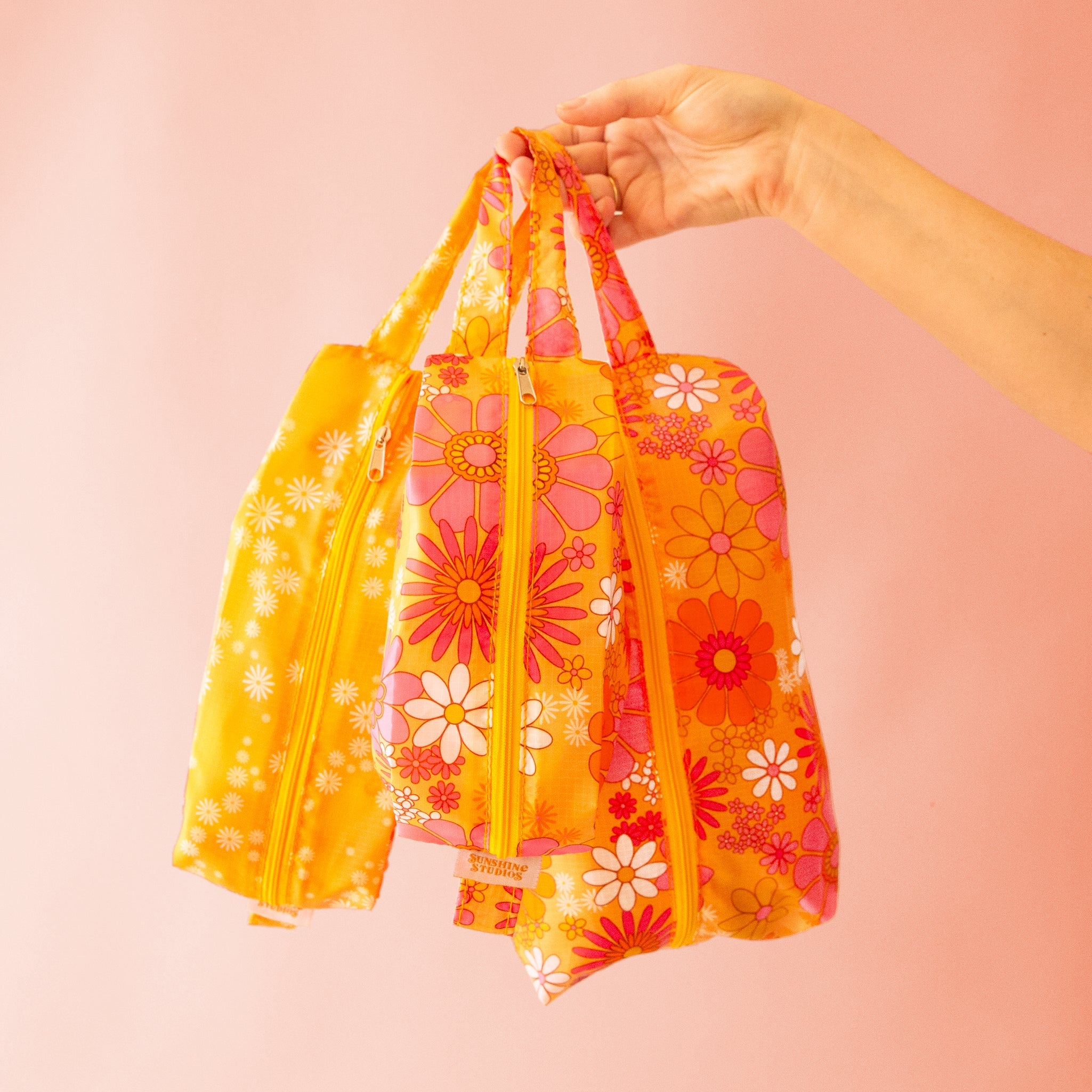 orange packing pouches with pink and ivory 70&#39;s floral design