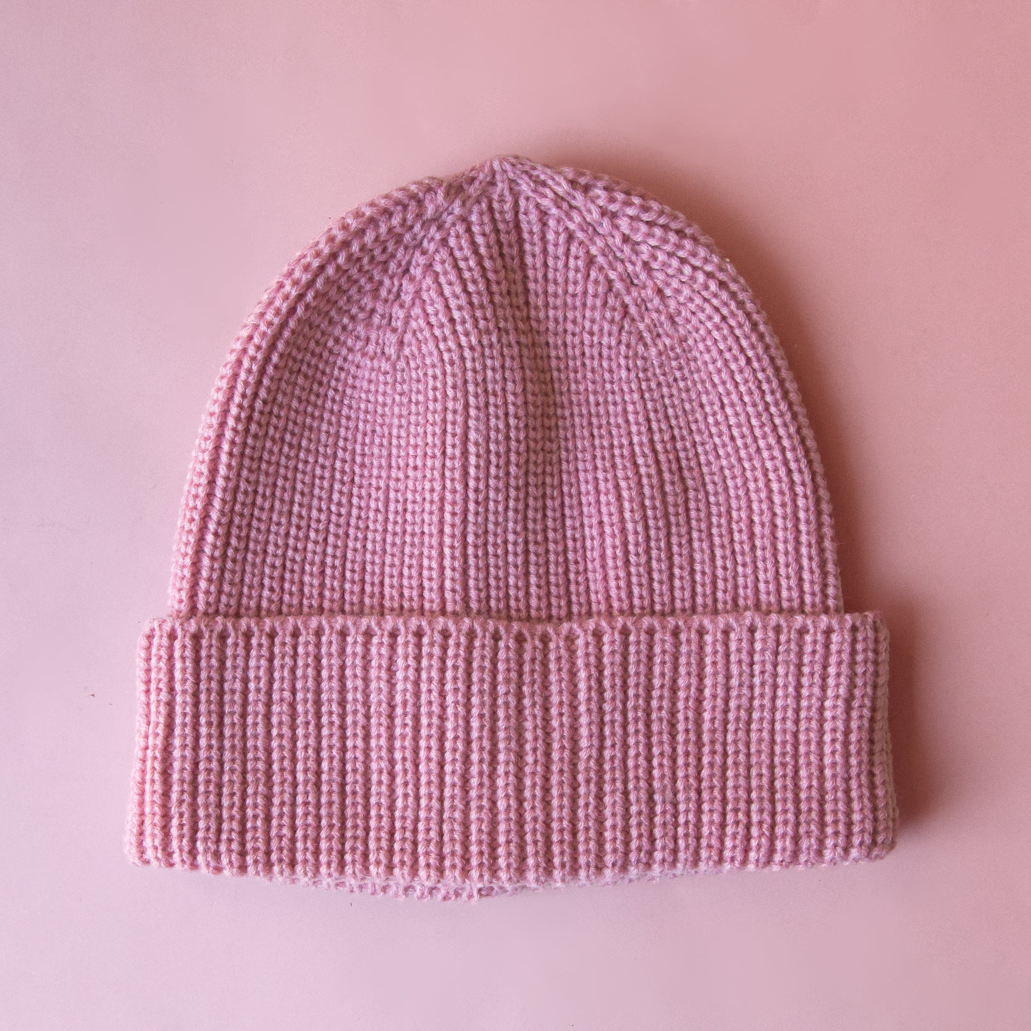 A dusty rose knit beanie. 