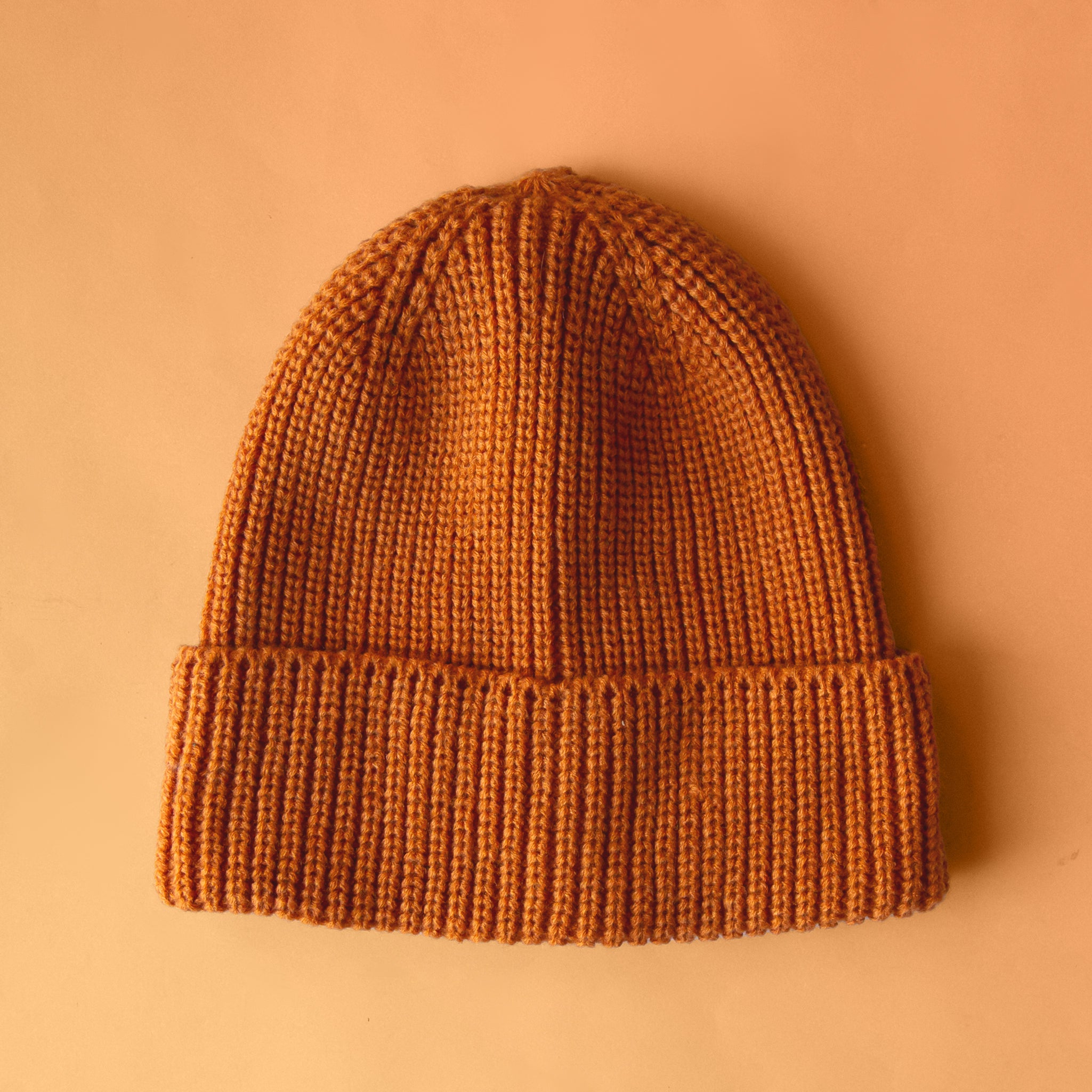 An orange knit beanie. 