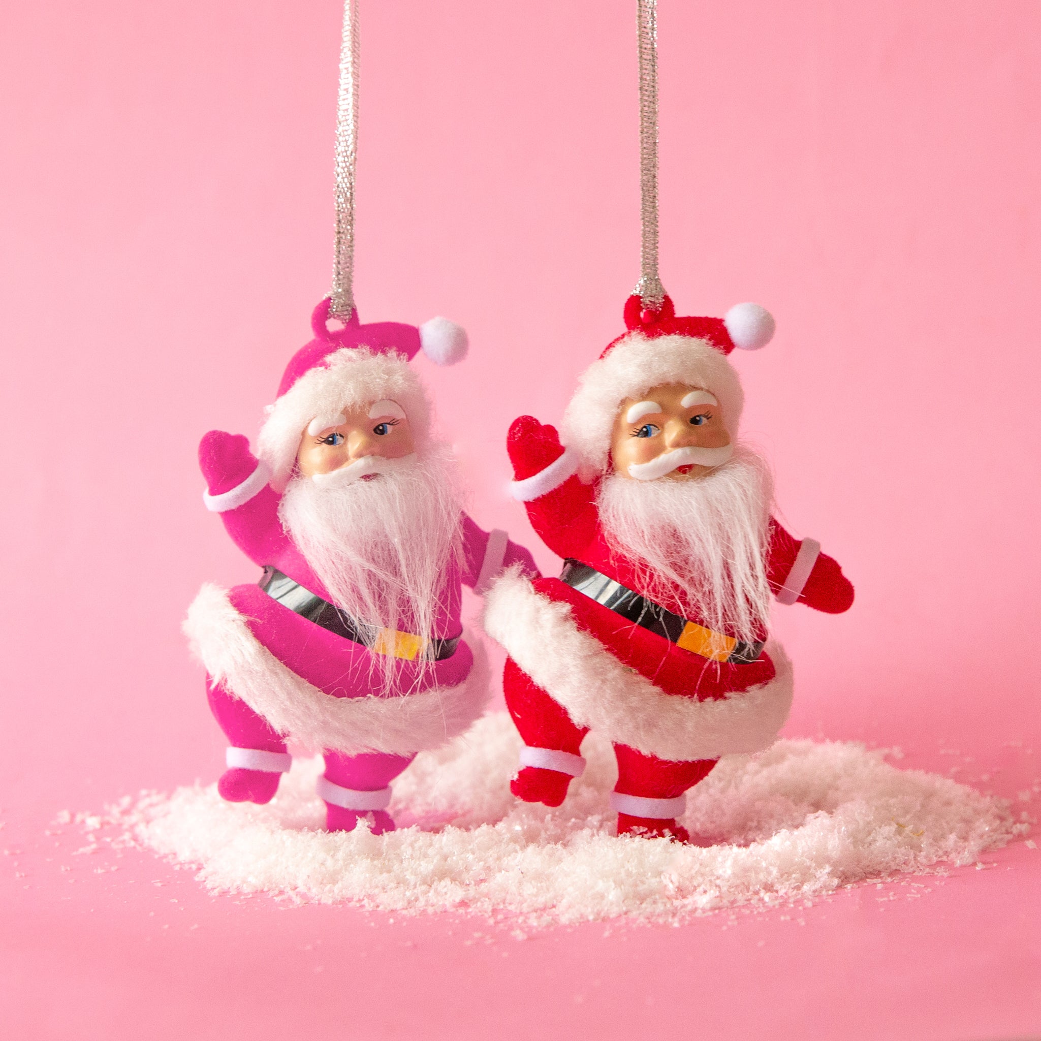 Two Santa shaped ornaments with a loop for hanging. Each ornament sold separately. 