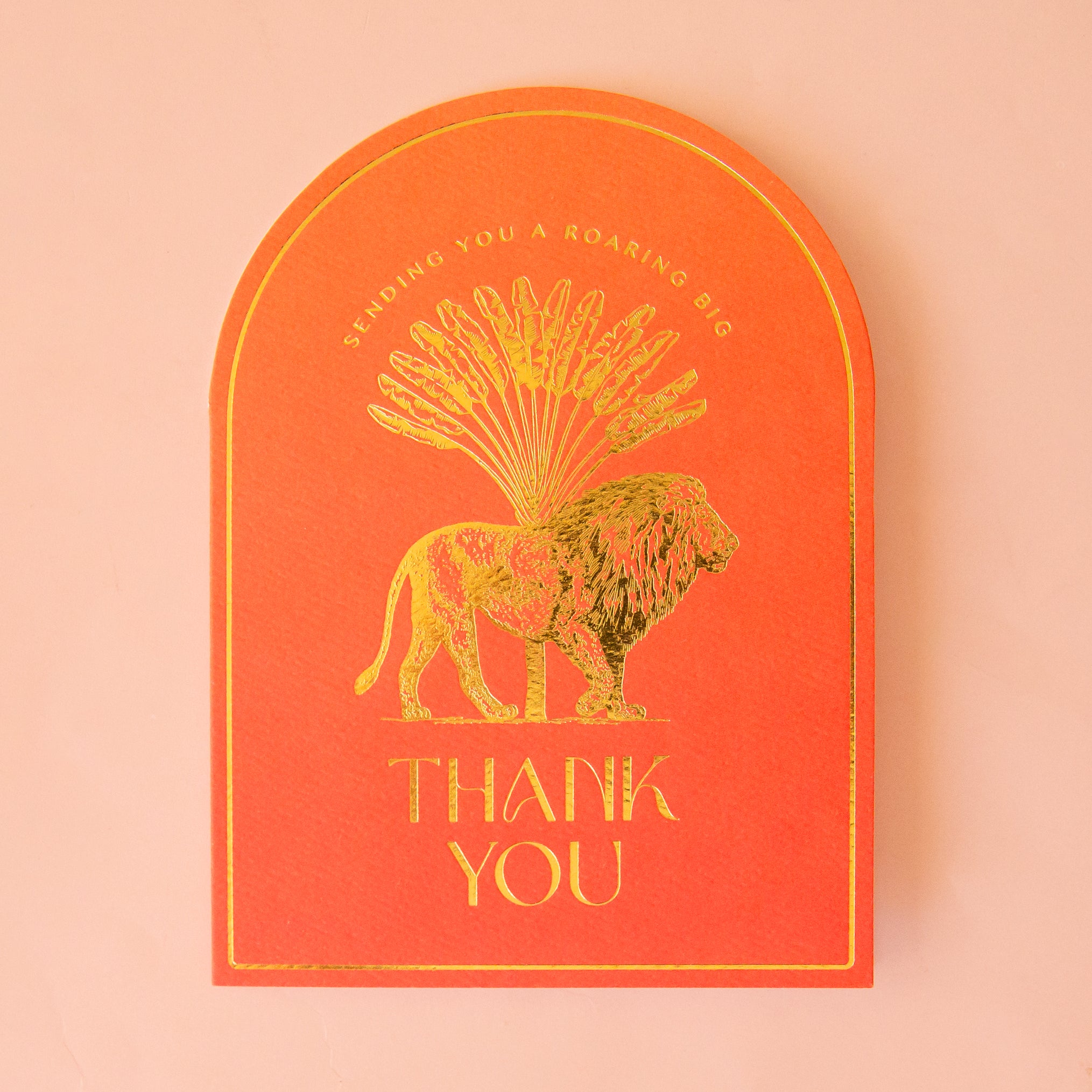 orange card with gold foil illustration of a lion. text reads sending you a roaring big thank you