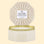 On a cream colored background is an octagon tin in a white shade with a white three wick candle inside along with a label on the lid that reads, "Voluspa Coconut Papaya". 