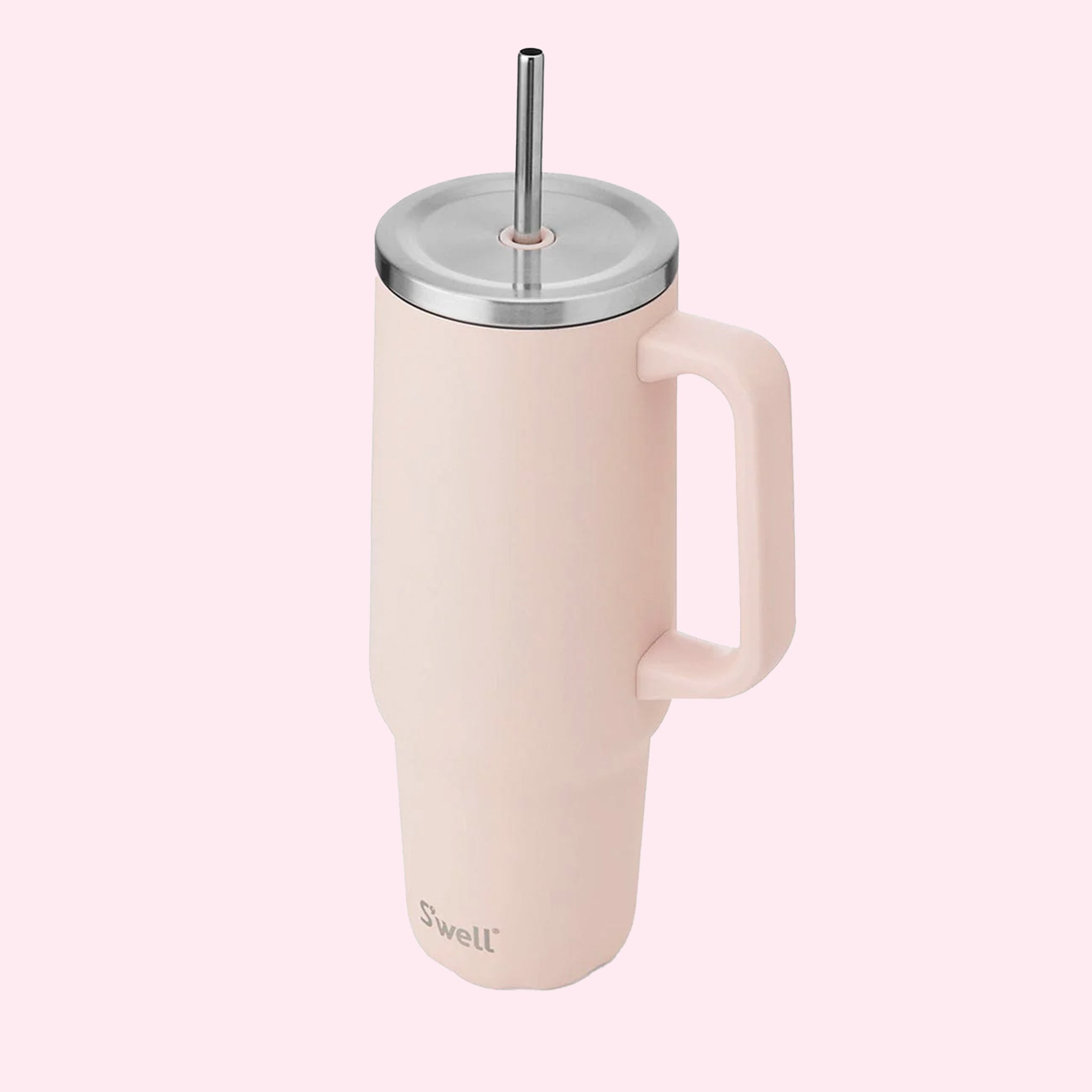 A light pink tumbler with a silver lid and straw.