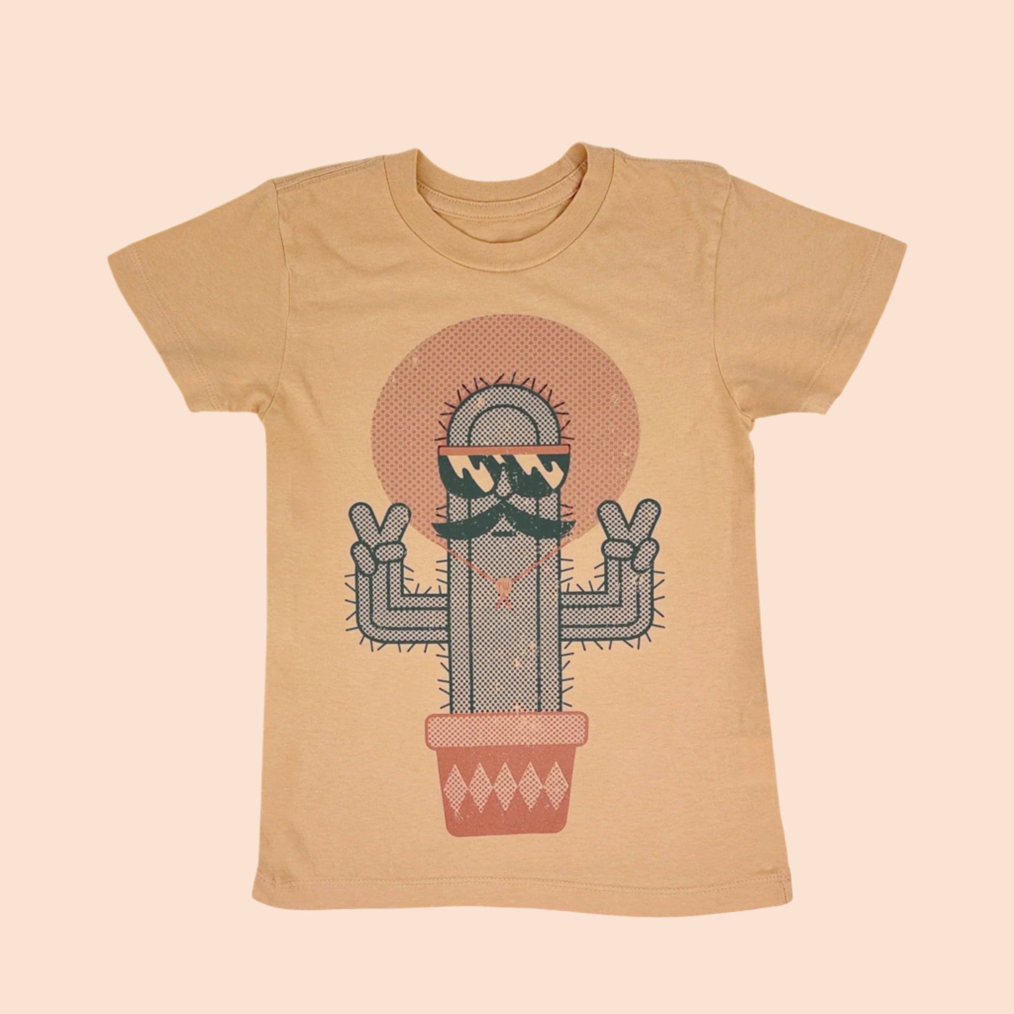 A tan short sleeved shirt with a graphic of a cactus with sunglasses and a mustache. 