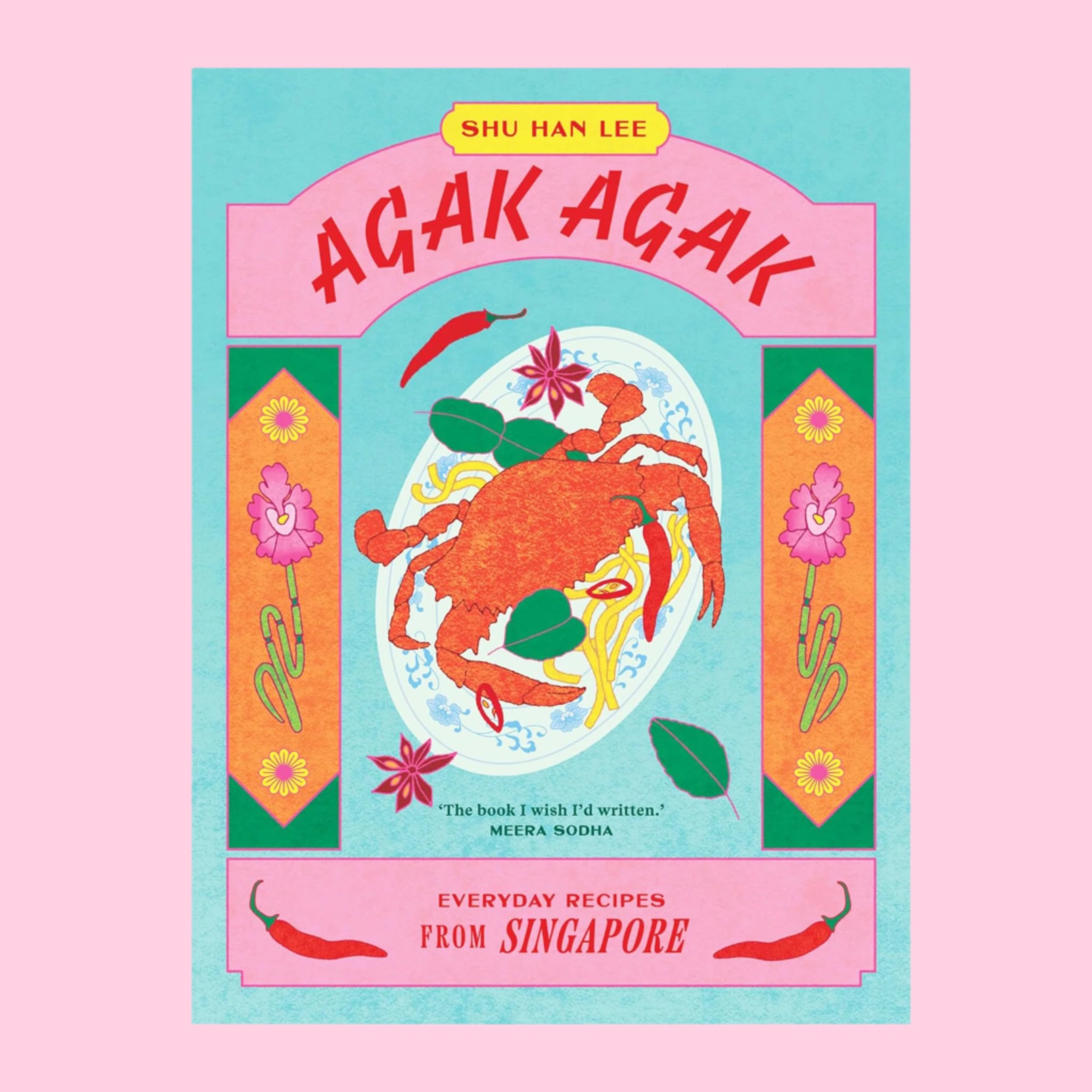 A multi colored cook book with an illustration of a crab dish on a plate and red text that reads, &#39;Agak Agak Everyday Recipes From Singapore&#39;. 