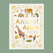 The front cover of the book reads 'The Animal Atlas': A pictorial Guide to the World's Wildlife' in gold lettering. The text is surround by a variety of animals including tigers, turtles, giraffes, and more. The cover of the book is bordered with elegant gold detailing.