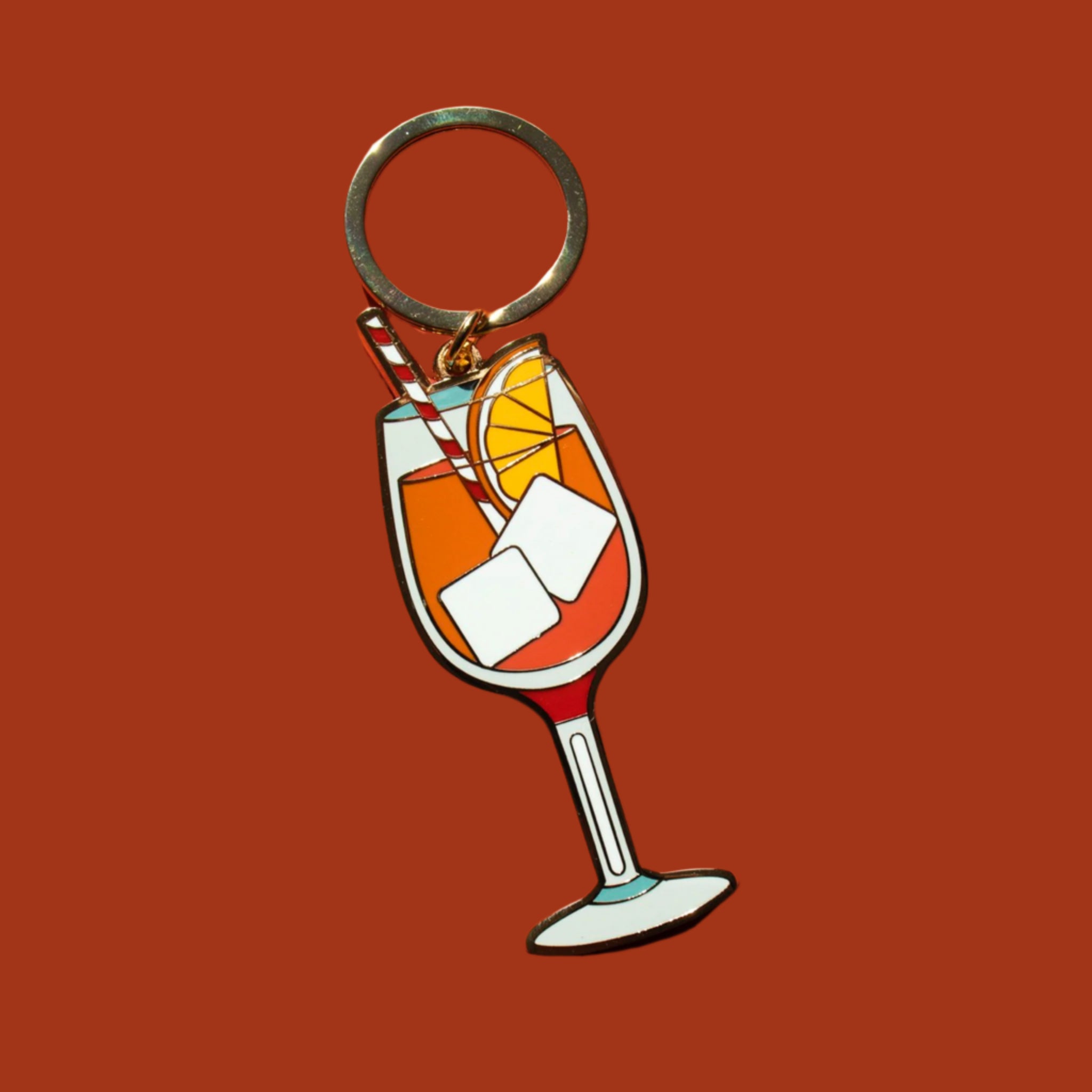 An aperol spritz shaped keychain. 