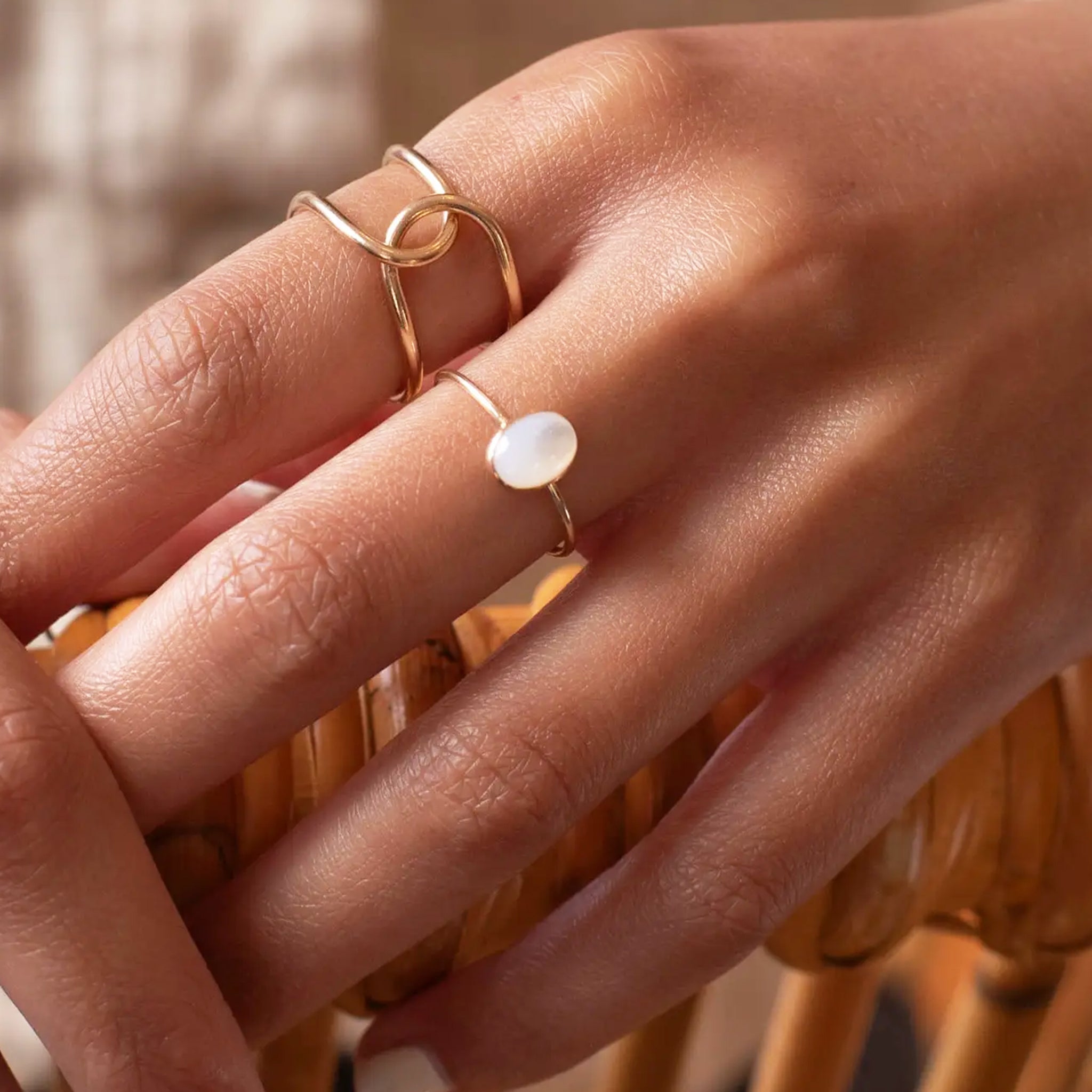 A ring with a round mother of pearl stone. 