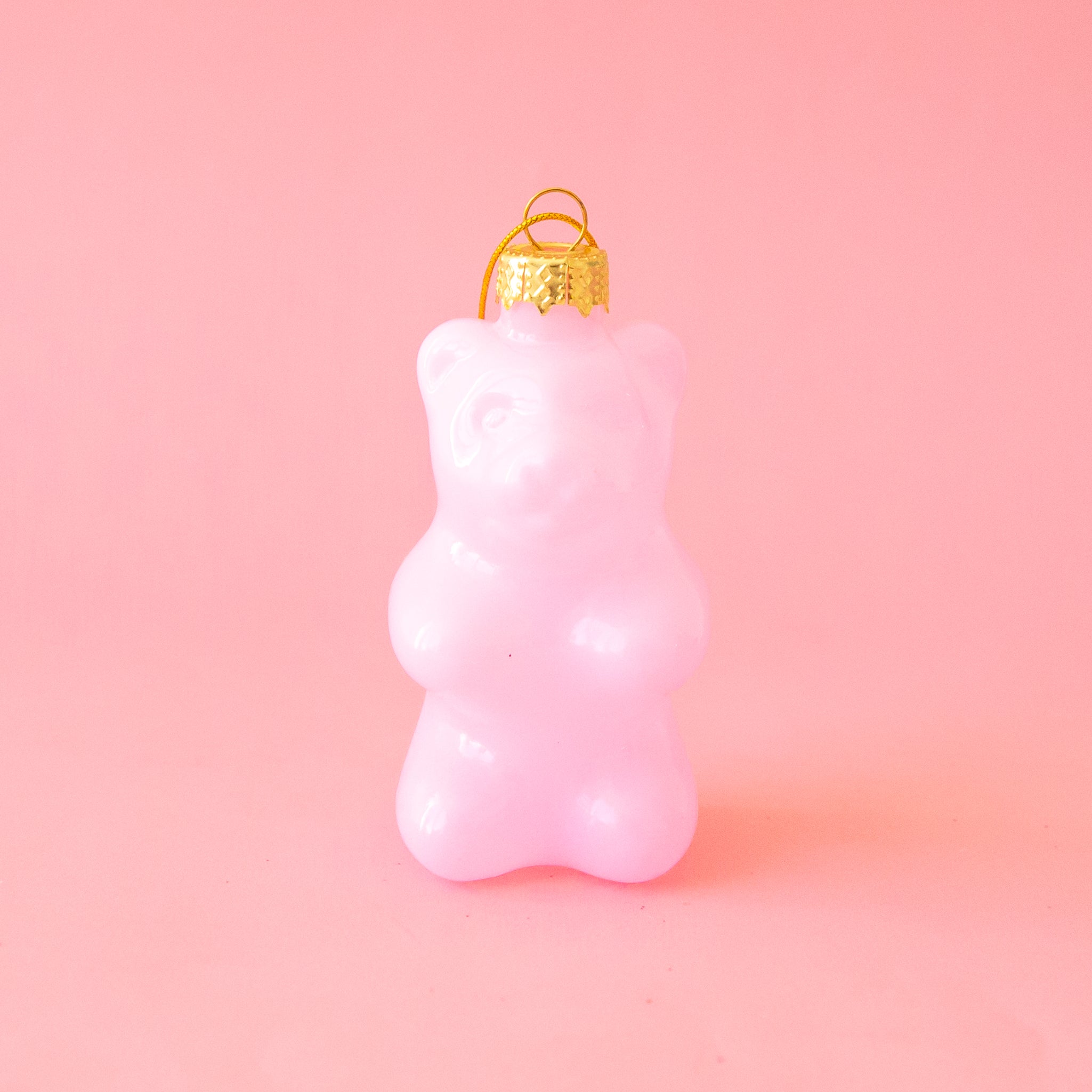 A light pink gummy bear shaped ornament.