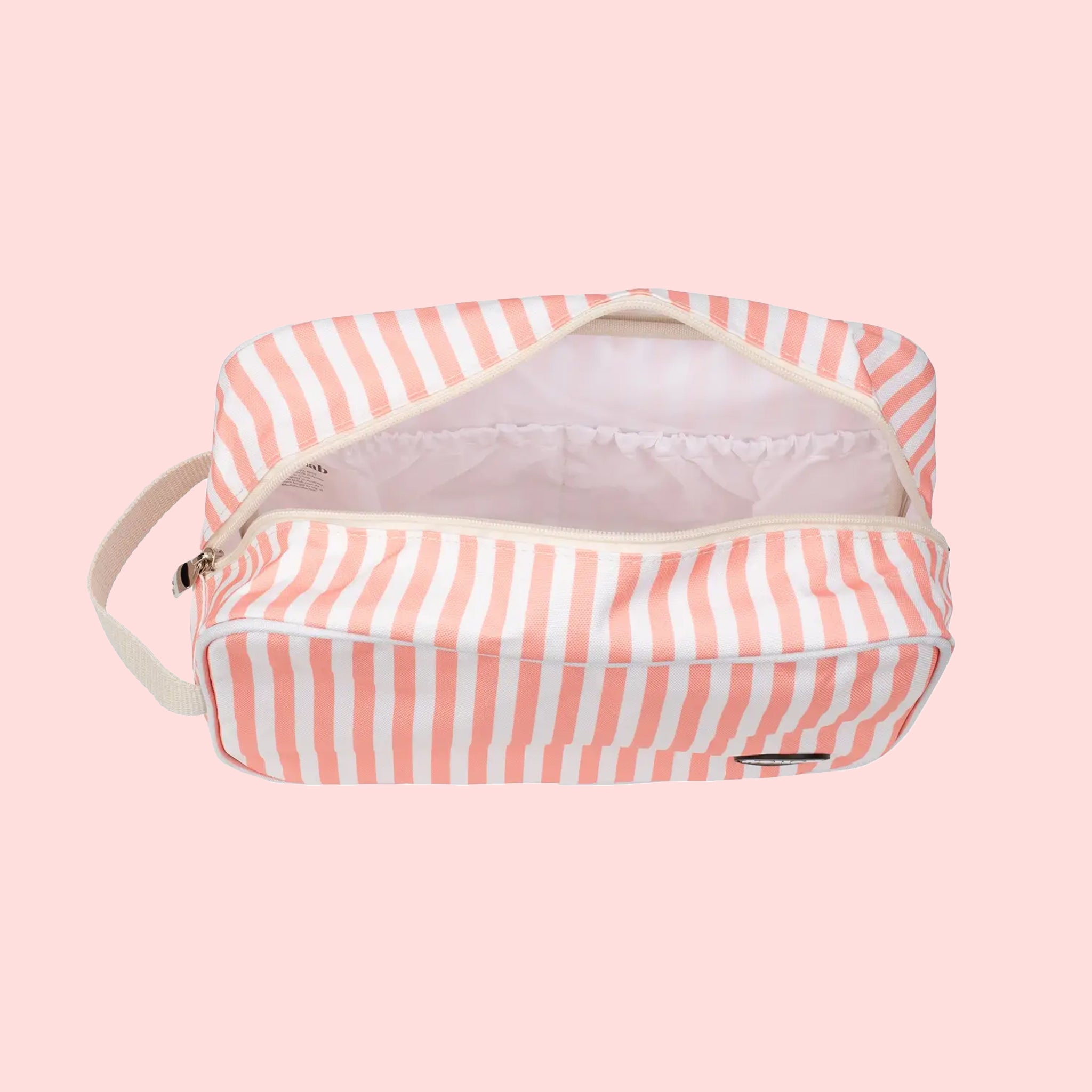 A coral and ivory striped cosmetic bag.