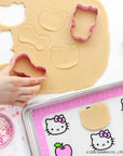 A set of baking accessories in hello kitty shapes and designs.