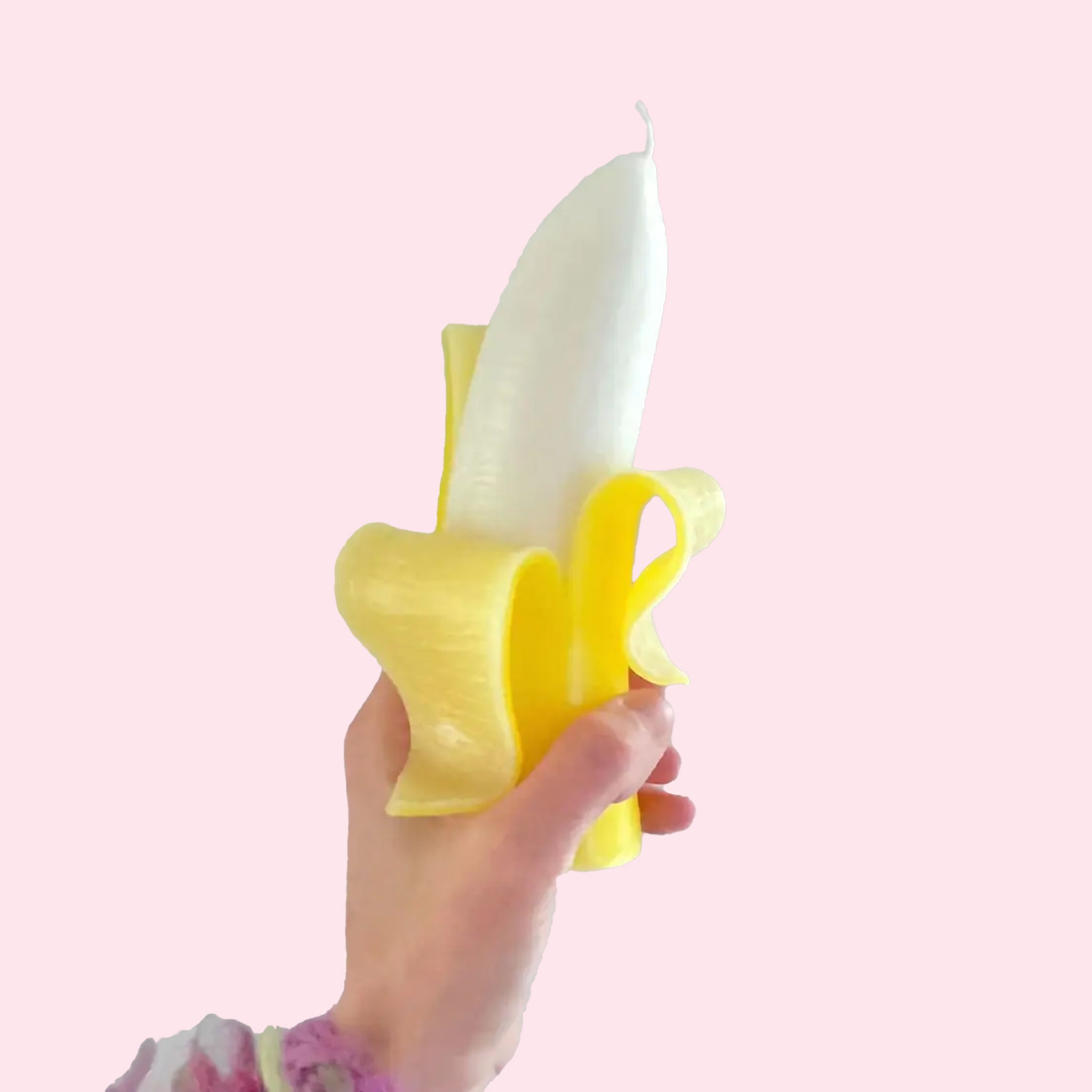 A yellow banana shaped candle. 