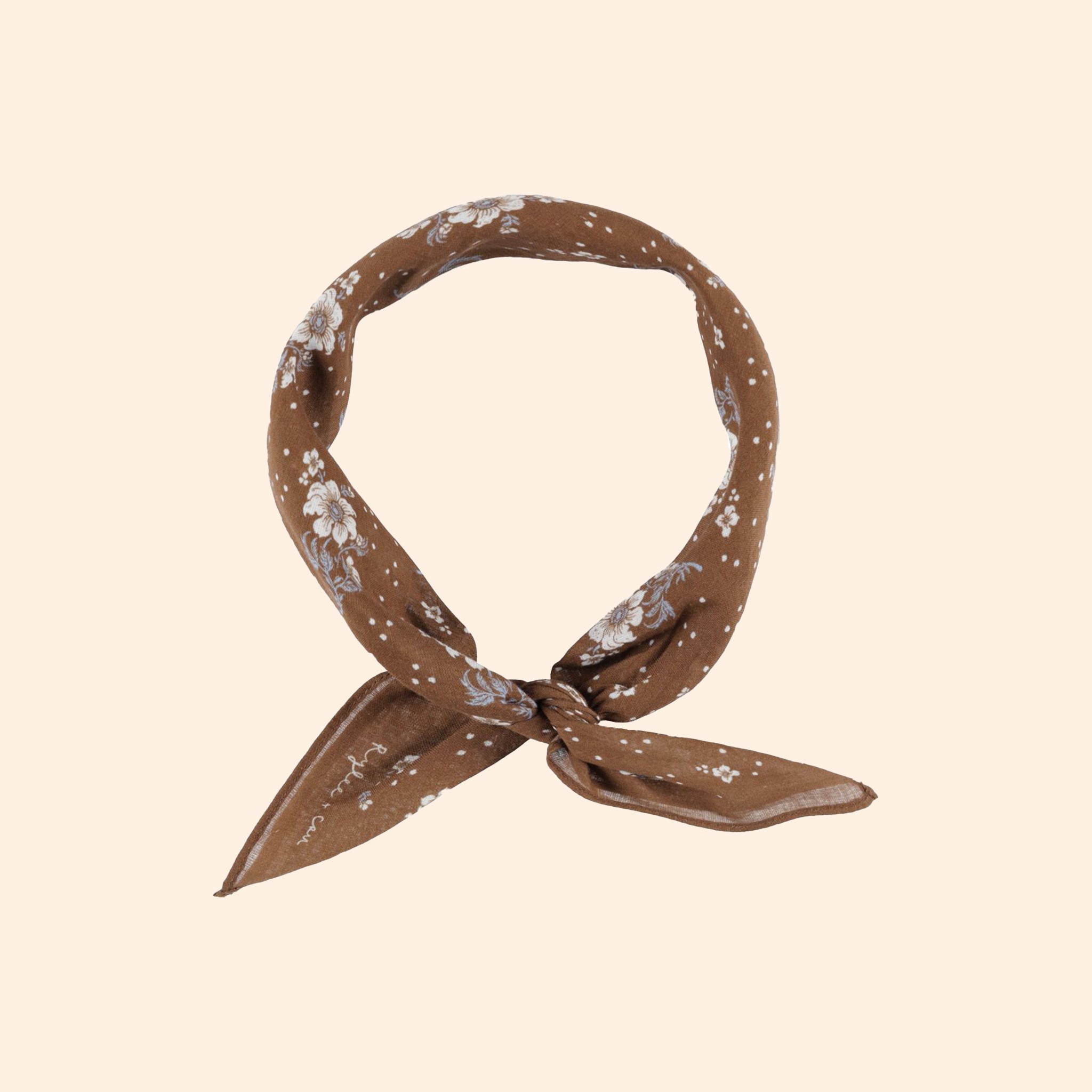 A brown bandana with a floral print. 