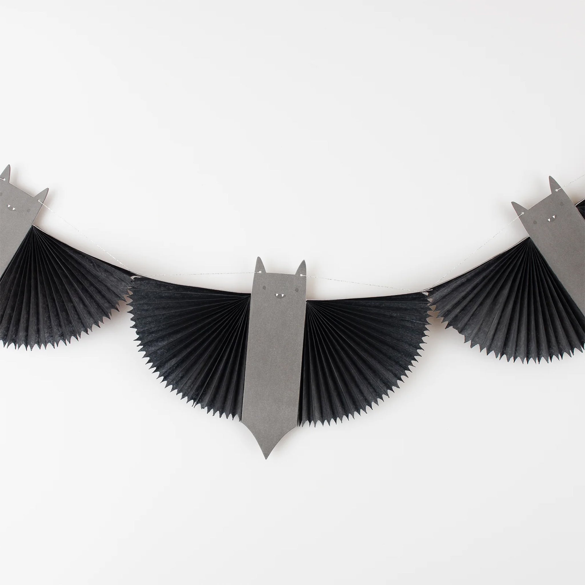 A black and grey paper bat garland.