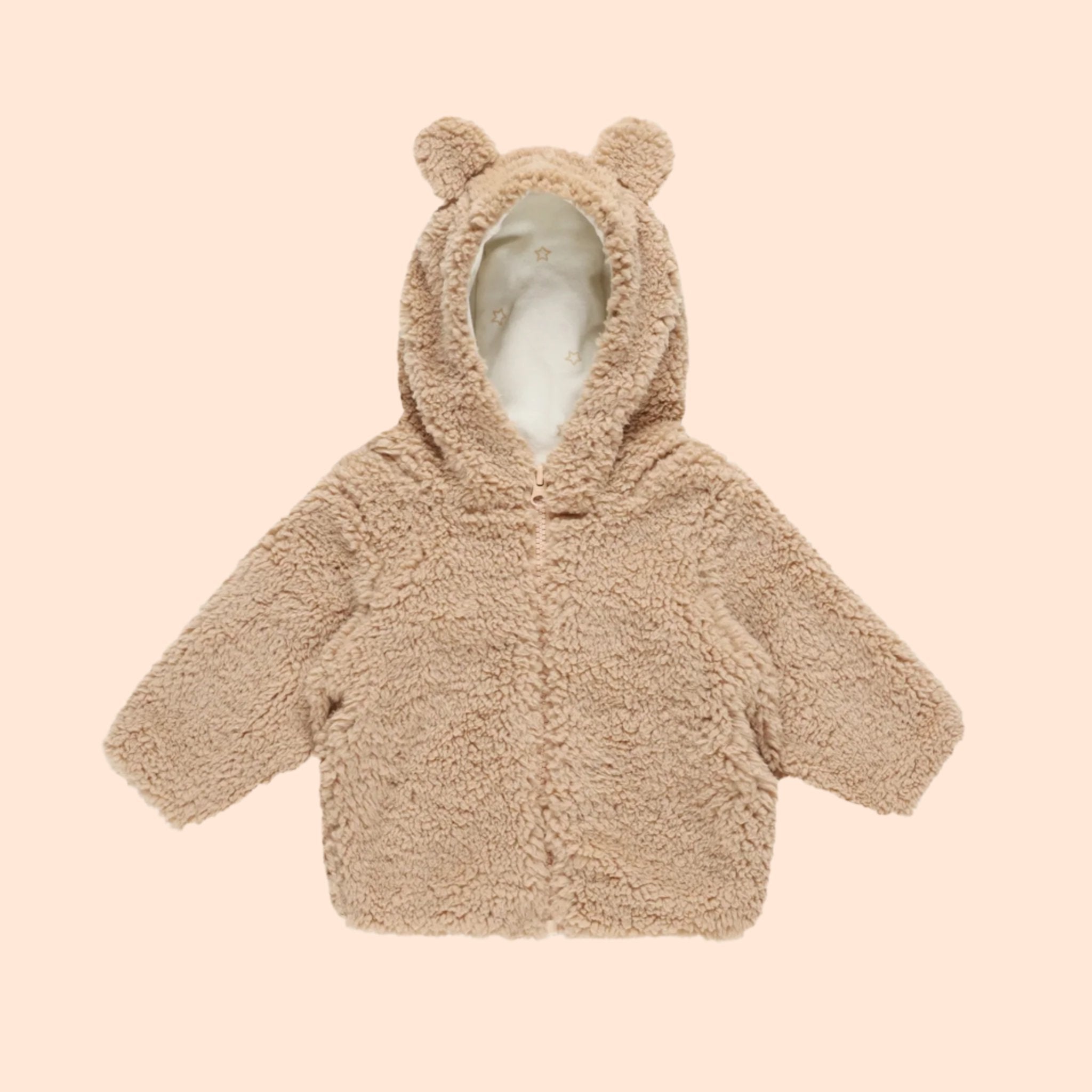 A beige fuzzy jacket with a bear hood with ears on the hood. 