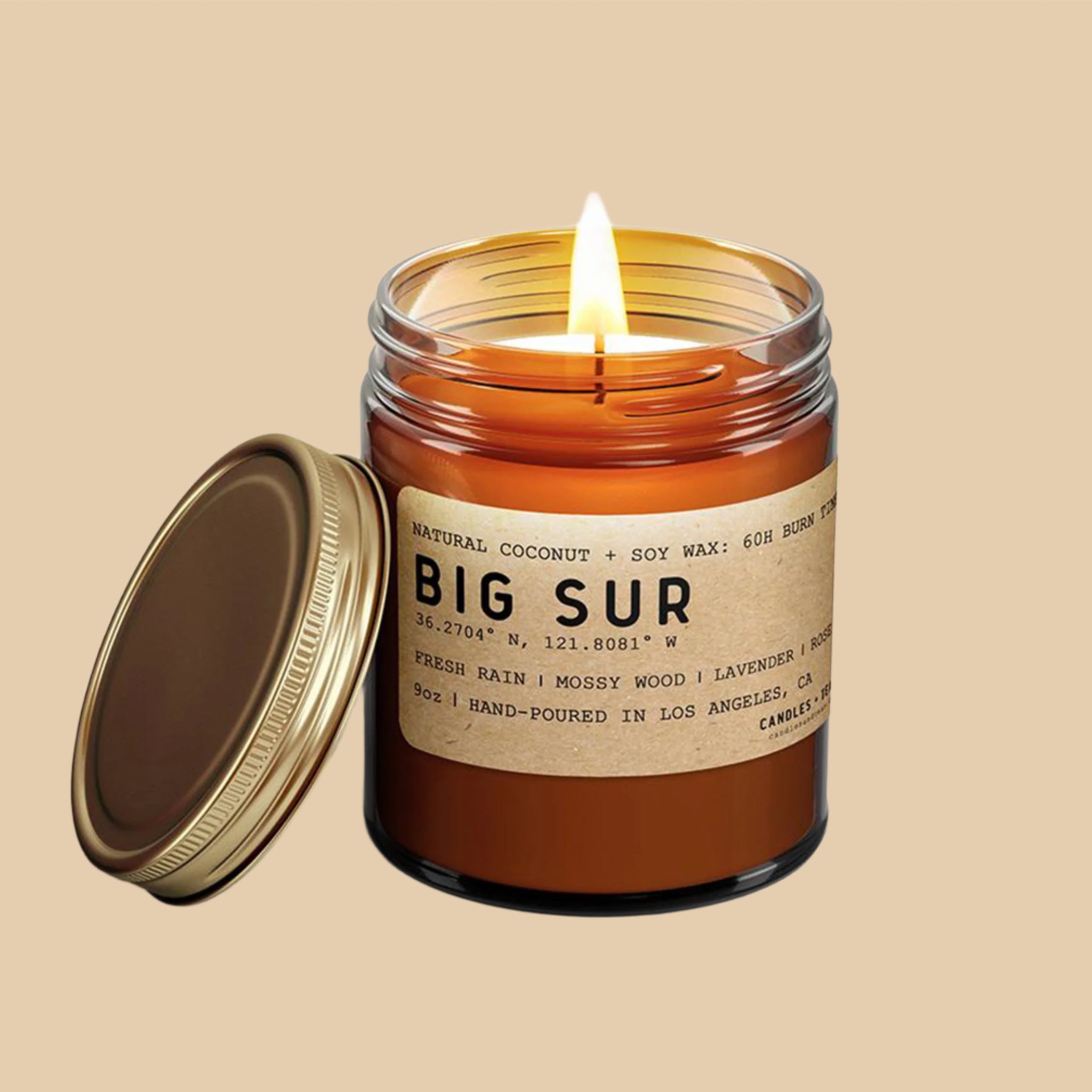 An amber candle jar with a brown kraft label and black text that reads, 'Natural Coconut + Soy Wax: 60h Burn Time Big Sur'. 