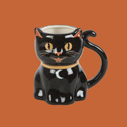 A black cat shaped ceramic mug. 