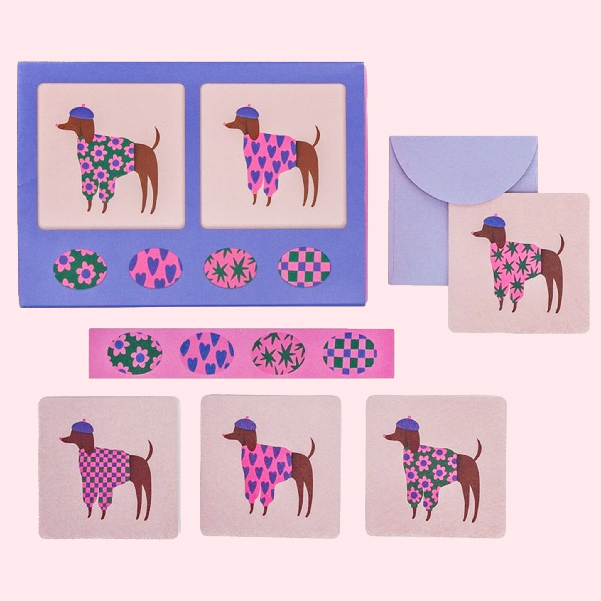 A set of mini note cards with dogs on it in different sweaters and berets, envelopes and stickers. 