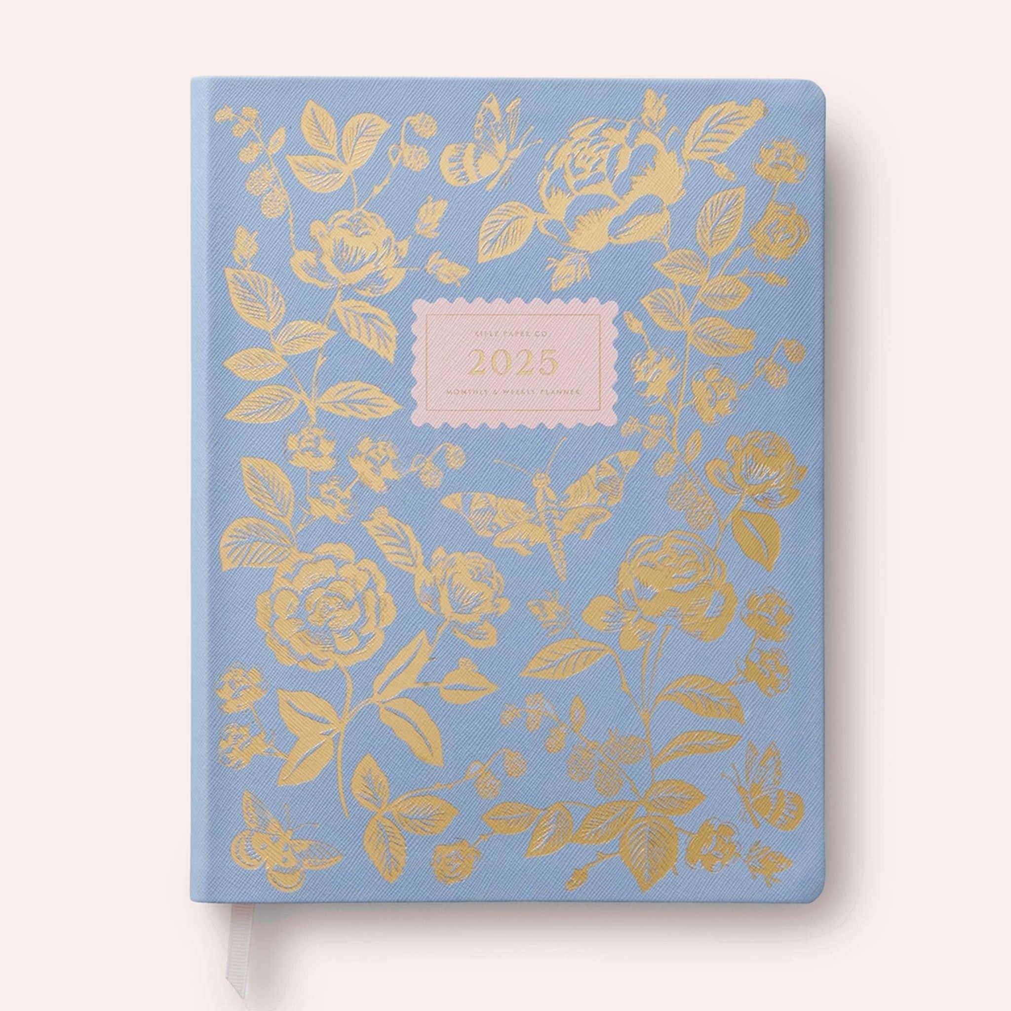 front cover of a bookbound planner, light blue with gold flowers