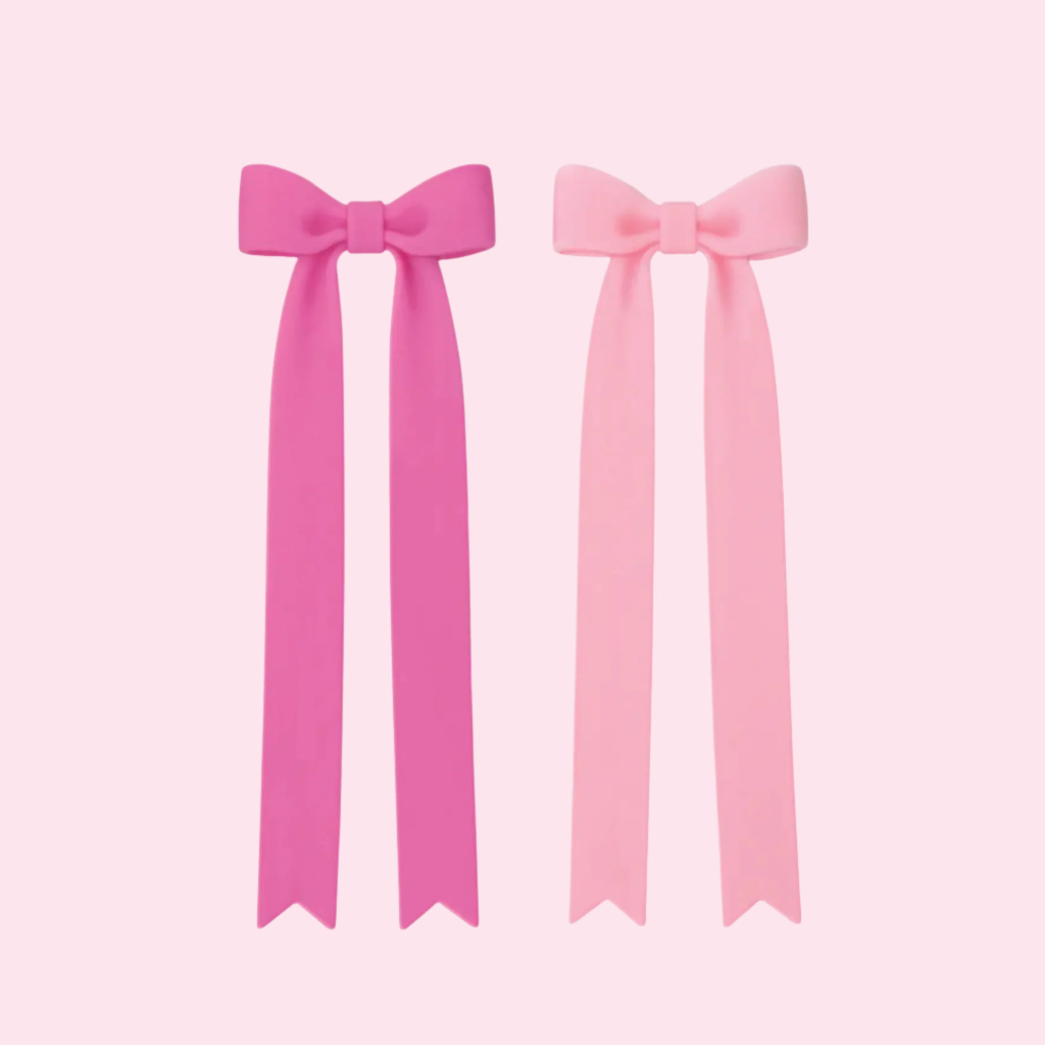 A set of two pink bow shaped bookmarks. 