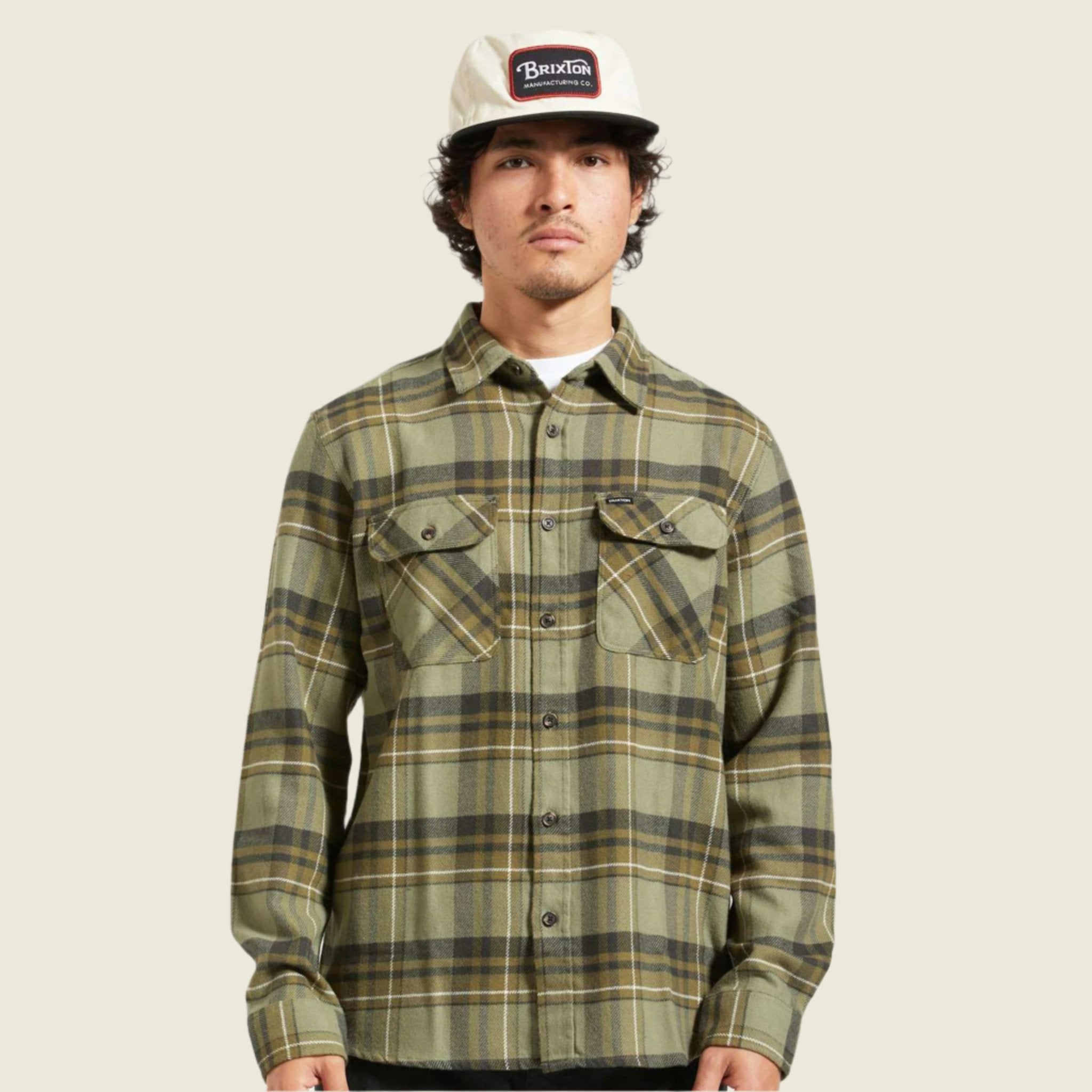 A green plaid flannel worn on a model. 