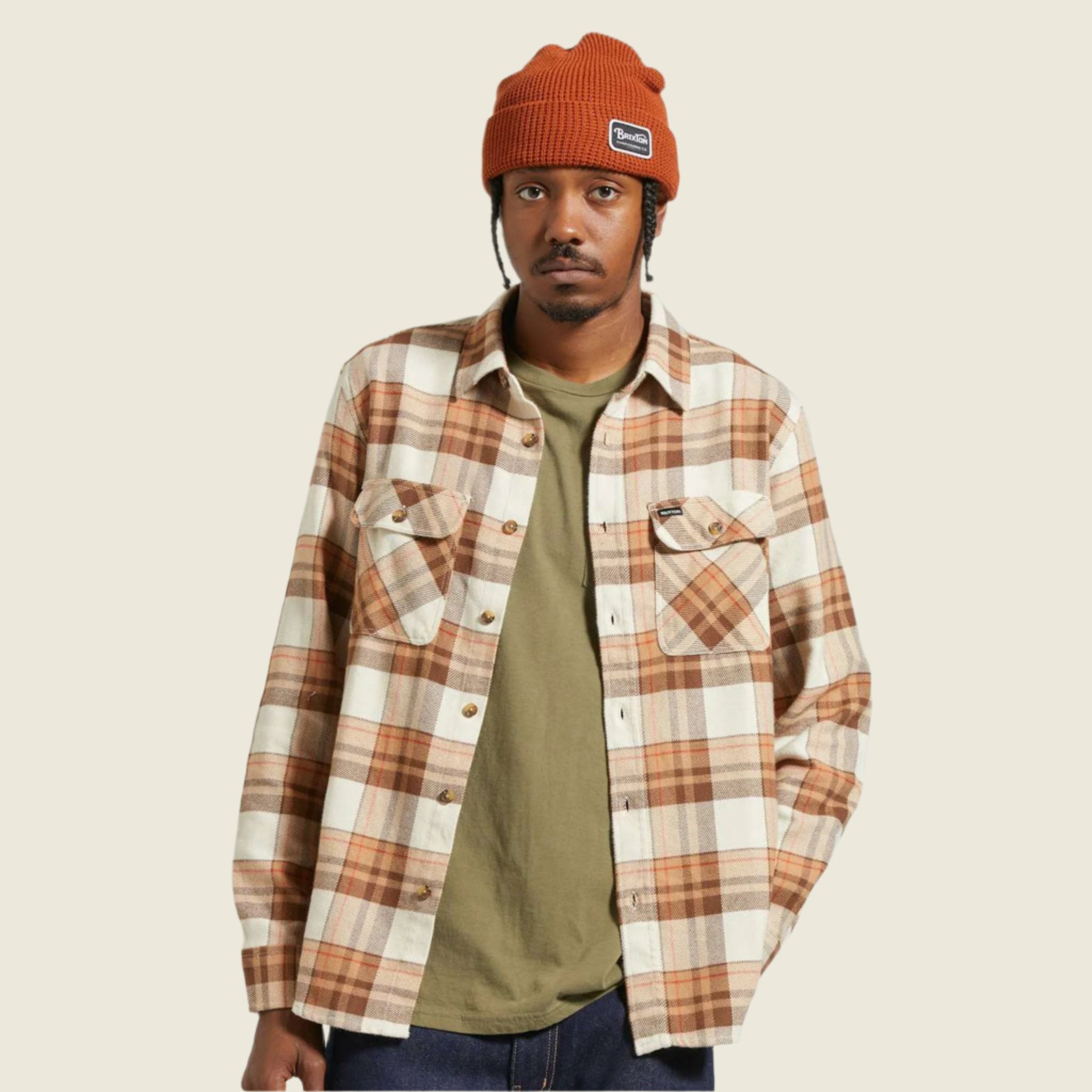 A tan, cream and brown plaid flannel shirt for men. 