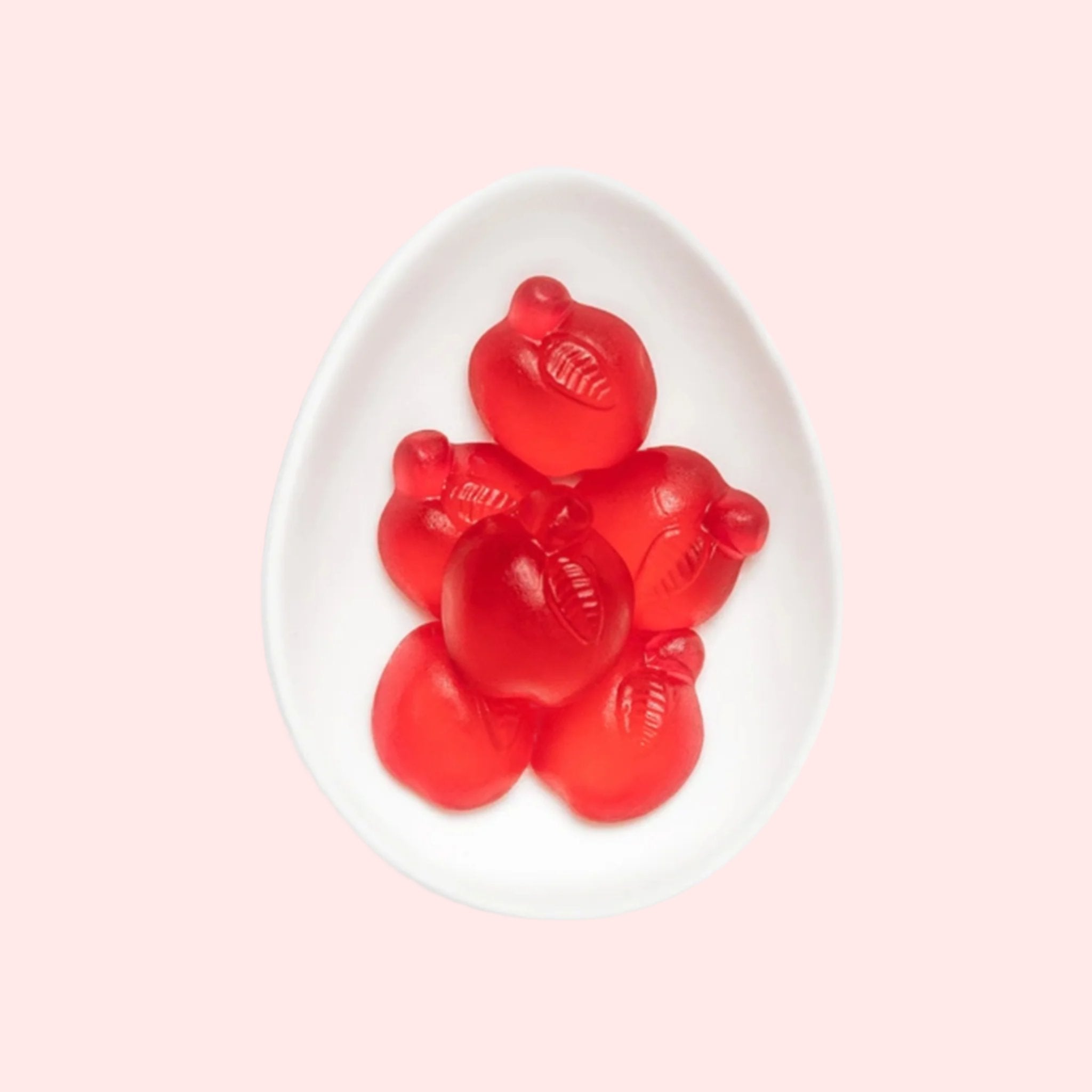 Gummy red, apple shaped candies.