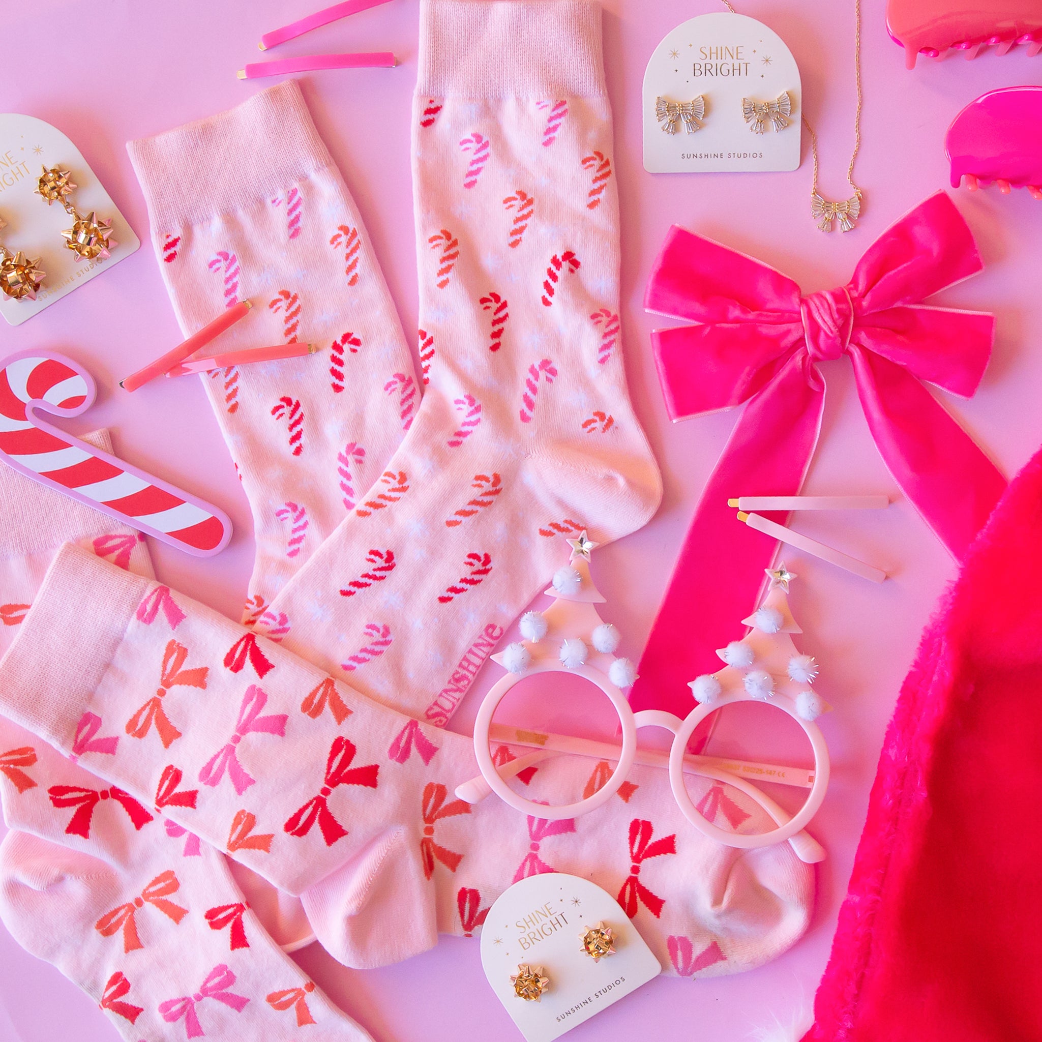 An assortment of pink holiday accessories. 