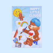 A blue magnet with a graphic of a Care Bear making a rainbow painting with text in the top right corner that reads, 'Happy Little Clouds'. 