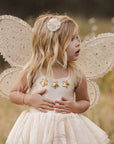 A set of champagne colored costume wings with champagne gold stars and elastic arm bands. 