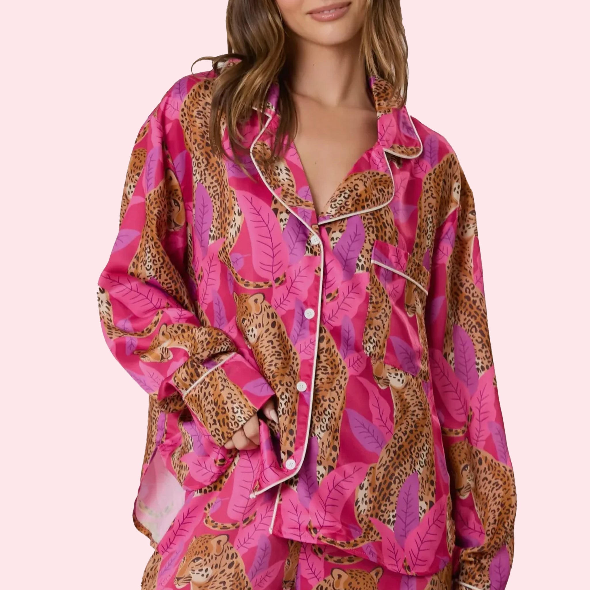 A hot pink and cheetah print button up long sleeve pajama top. 